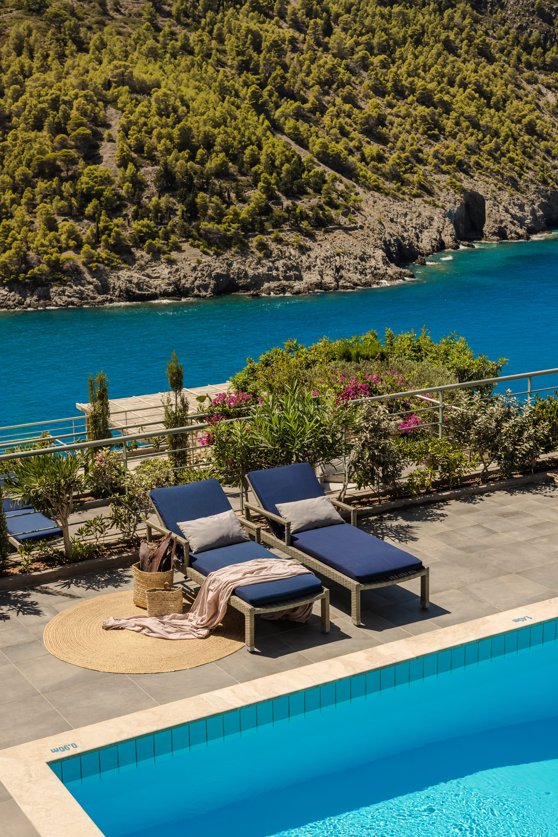 a pool with chairs and a deck