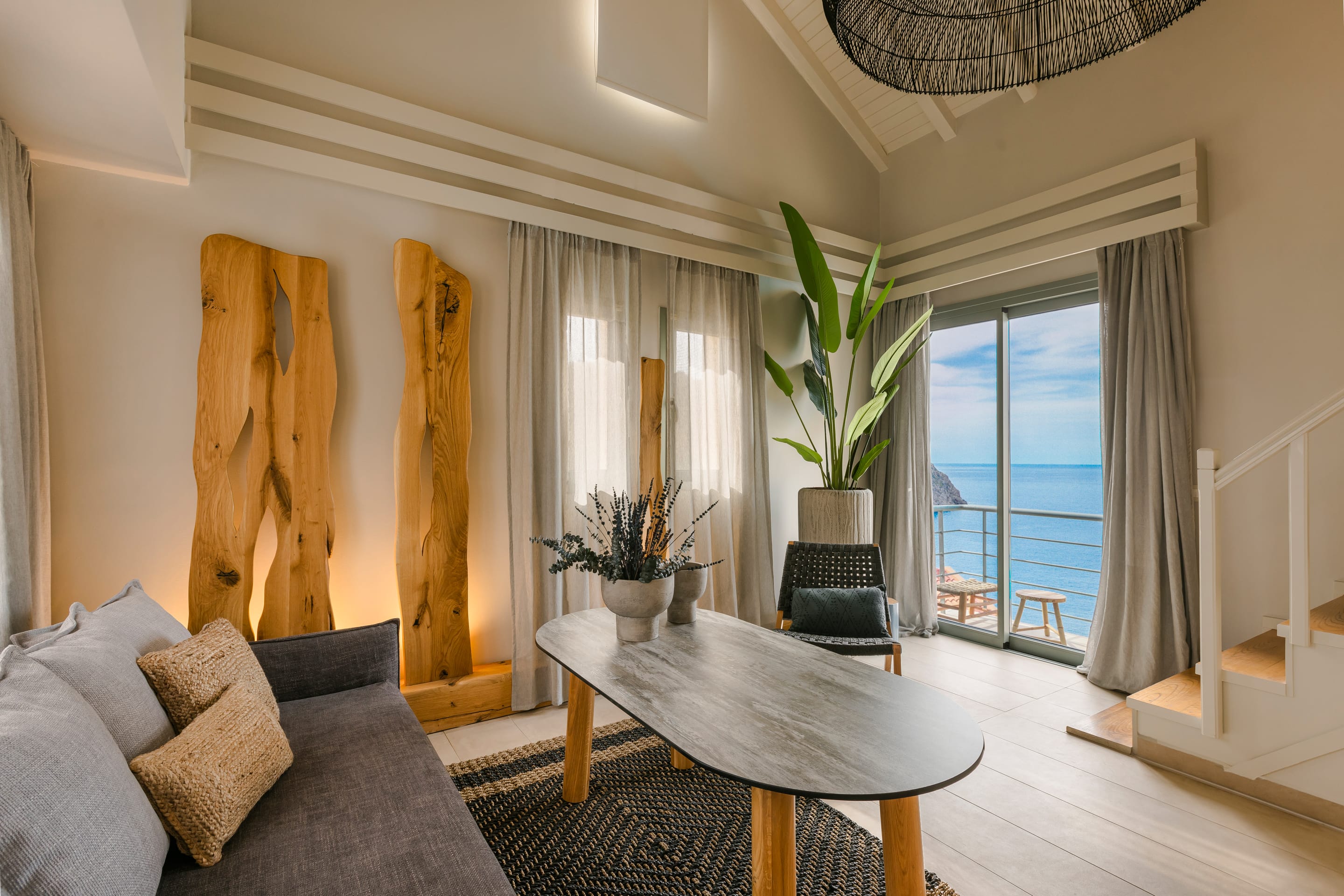 a living room with a table and chairs