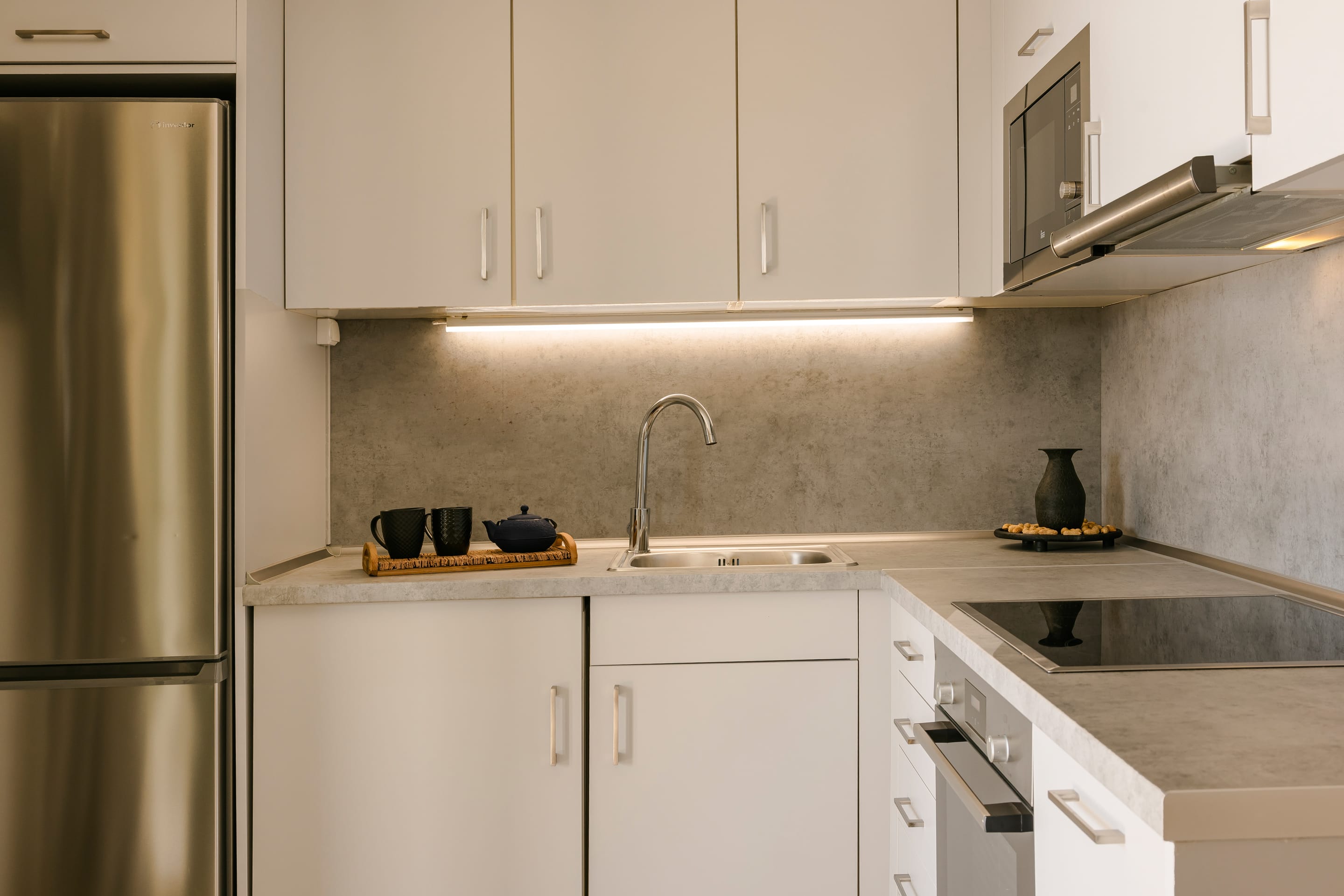 a kitchen with white cabinets