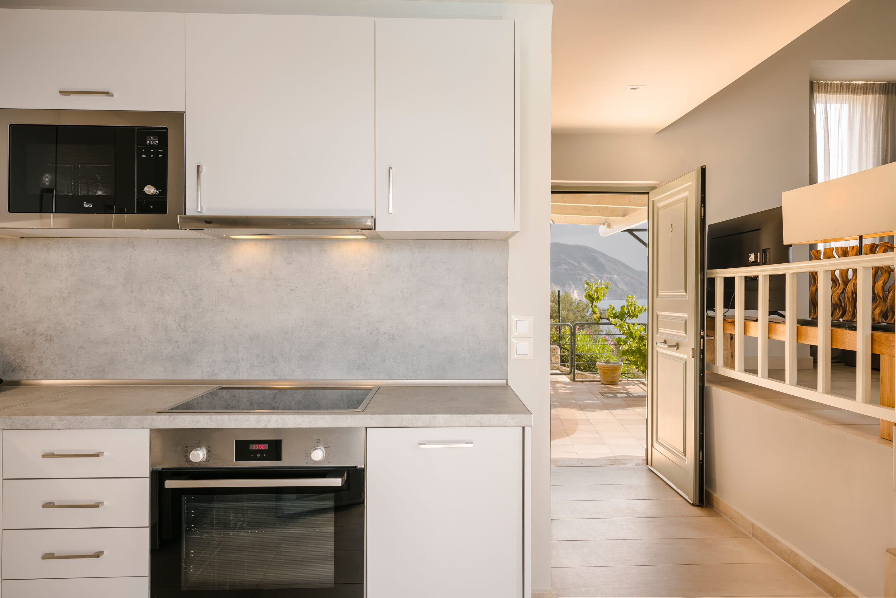 a kitchen with white cabinets