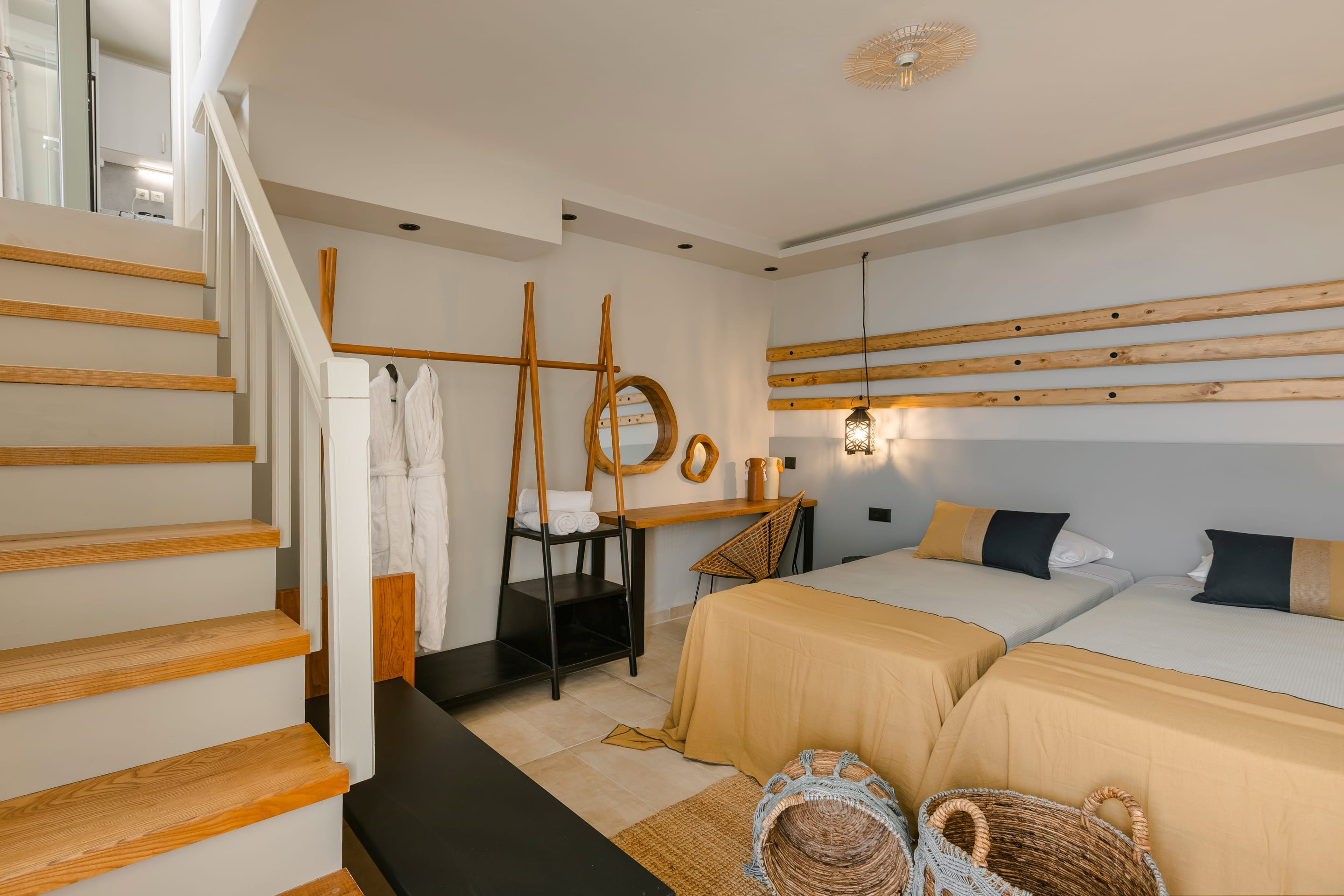 a bedroom with a bed and a staircase