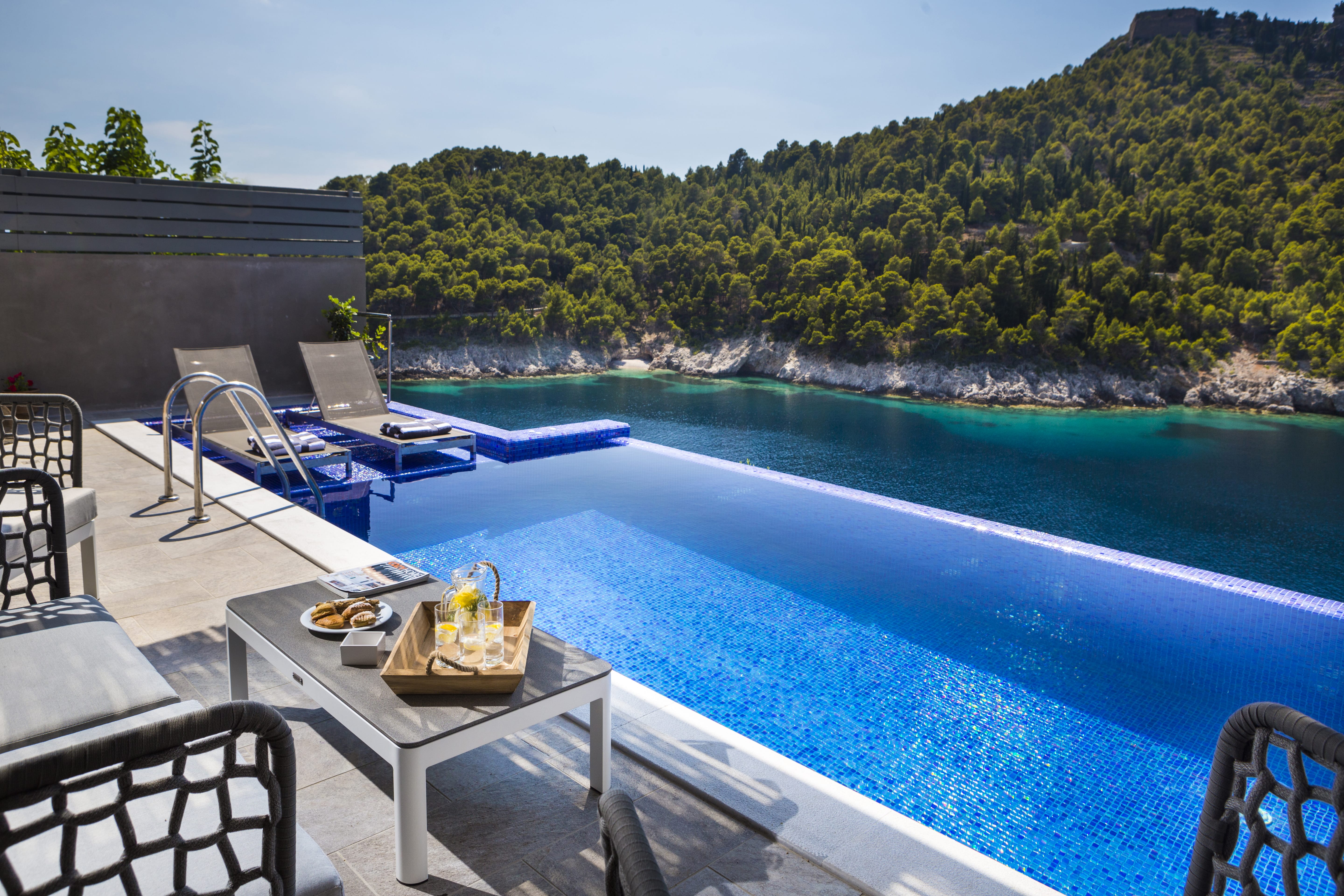 a pool with chairs around it