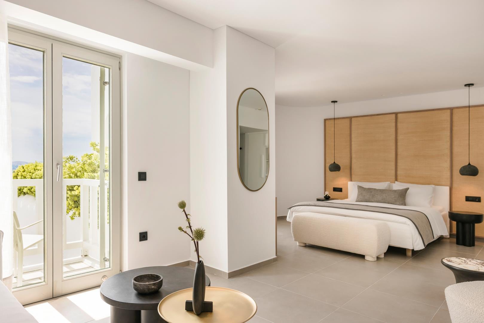 a room with a bed and a mirror