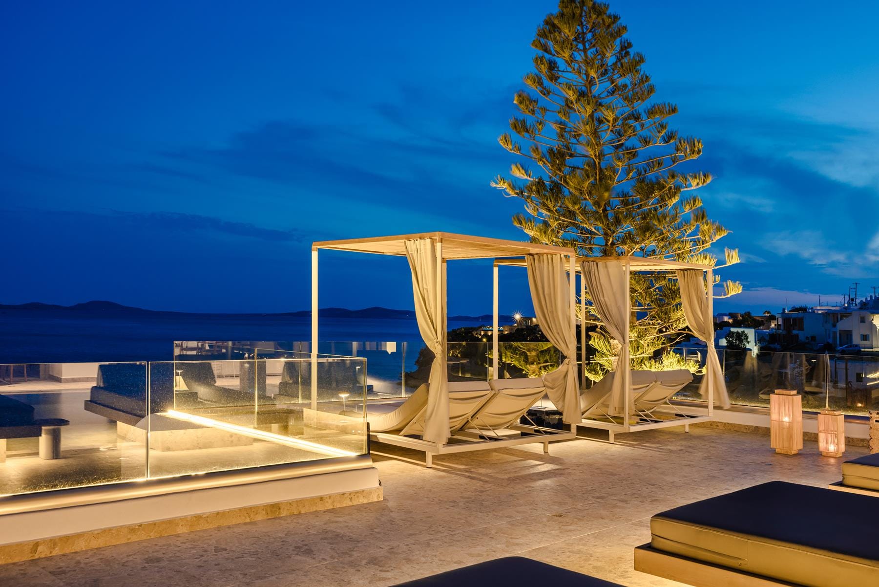 a structure outside with a tree in the front