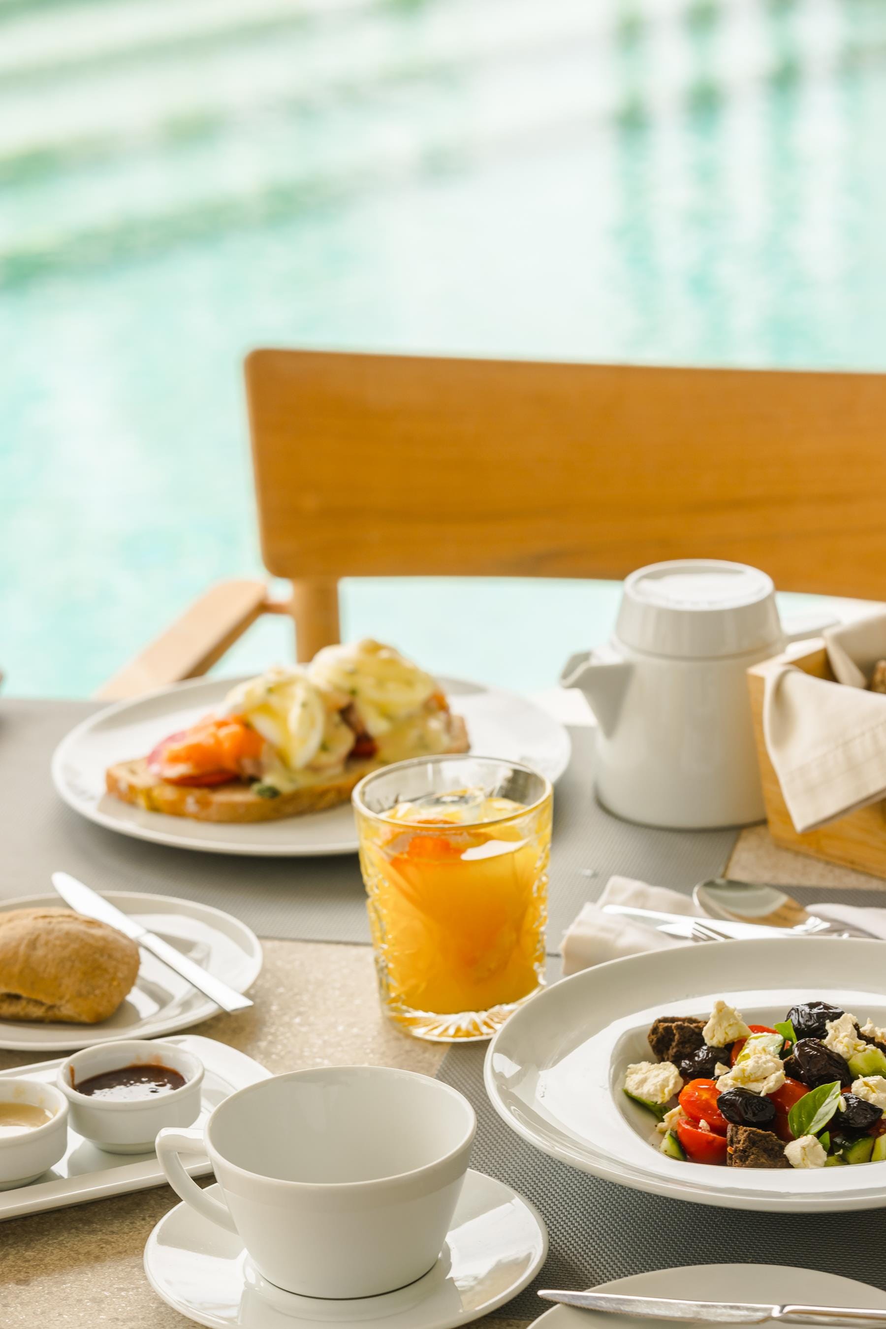 a table with plates of food and cups of juice