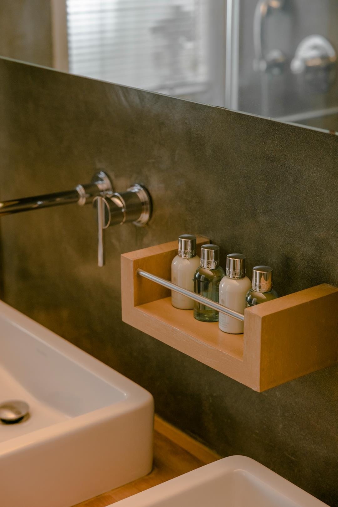 a bathroom with a mirror and a sink