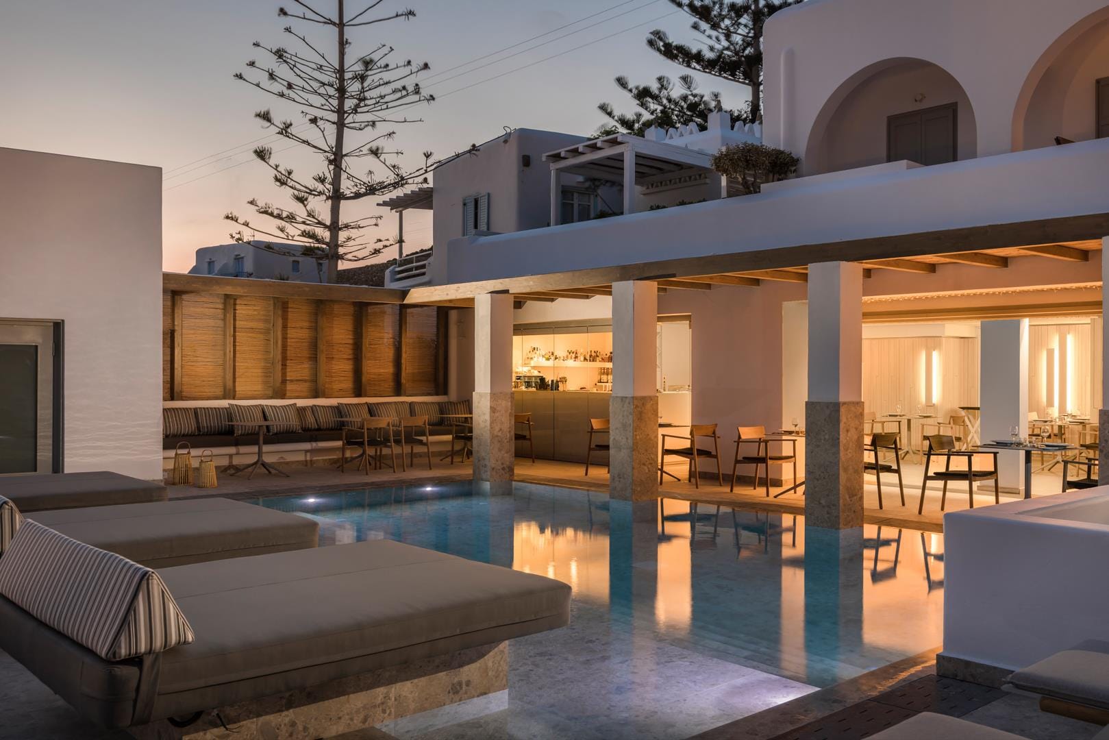 a swimming pool with a house in the background