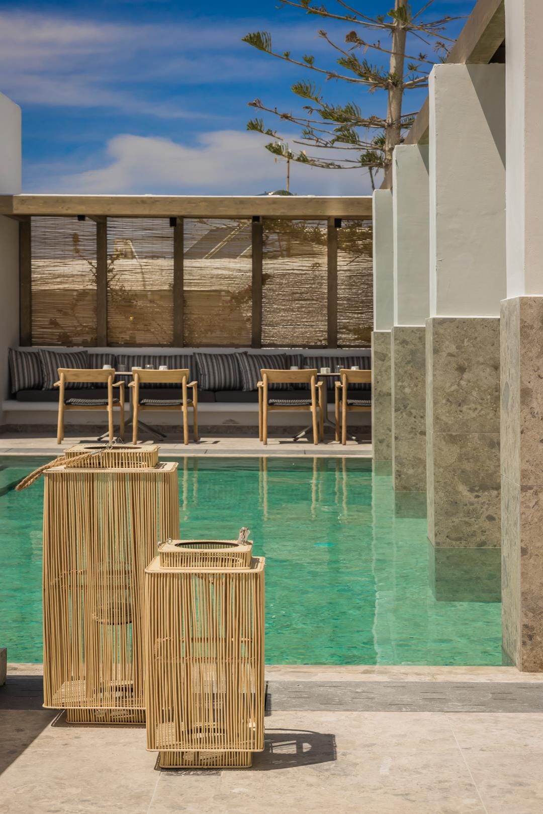 a pool with chairs and a table