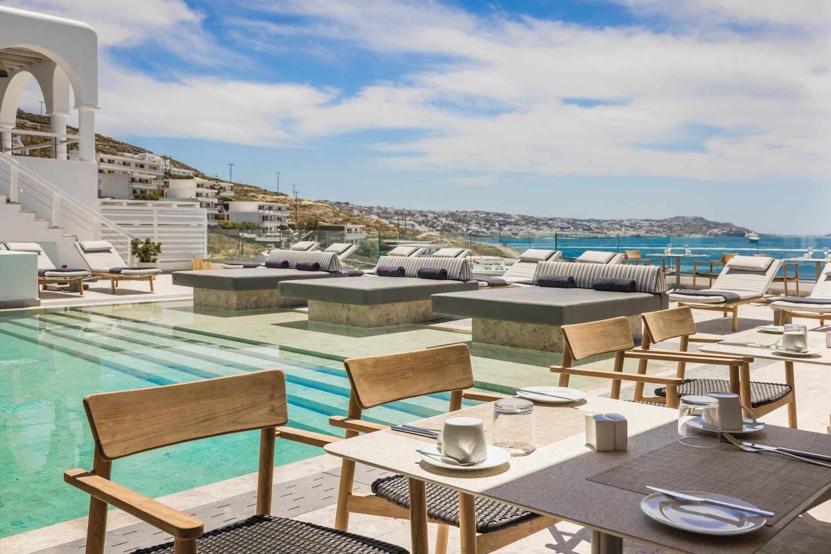 a patio with tables and chairs