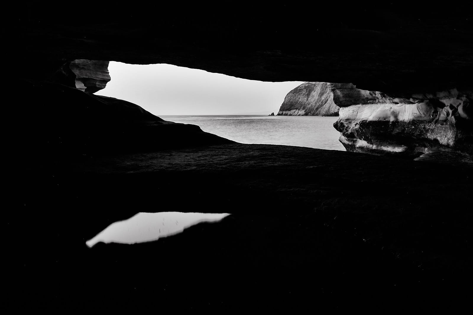 a cave with a few white objects in it