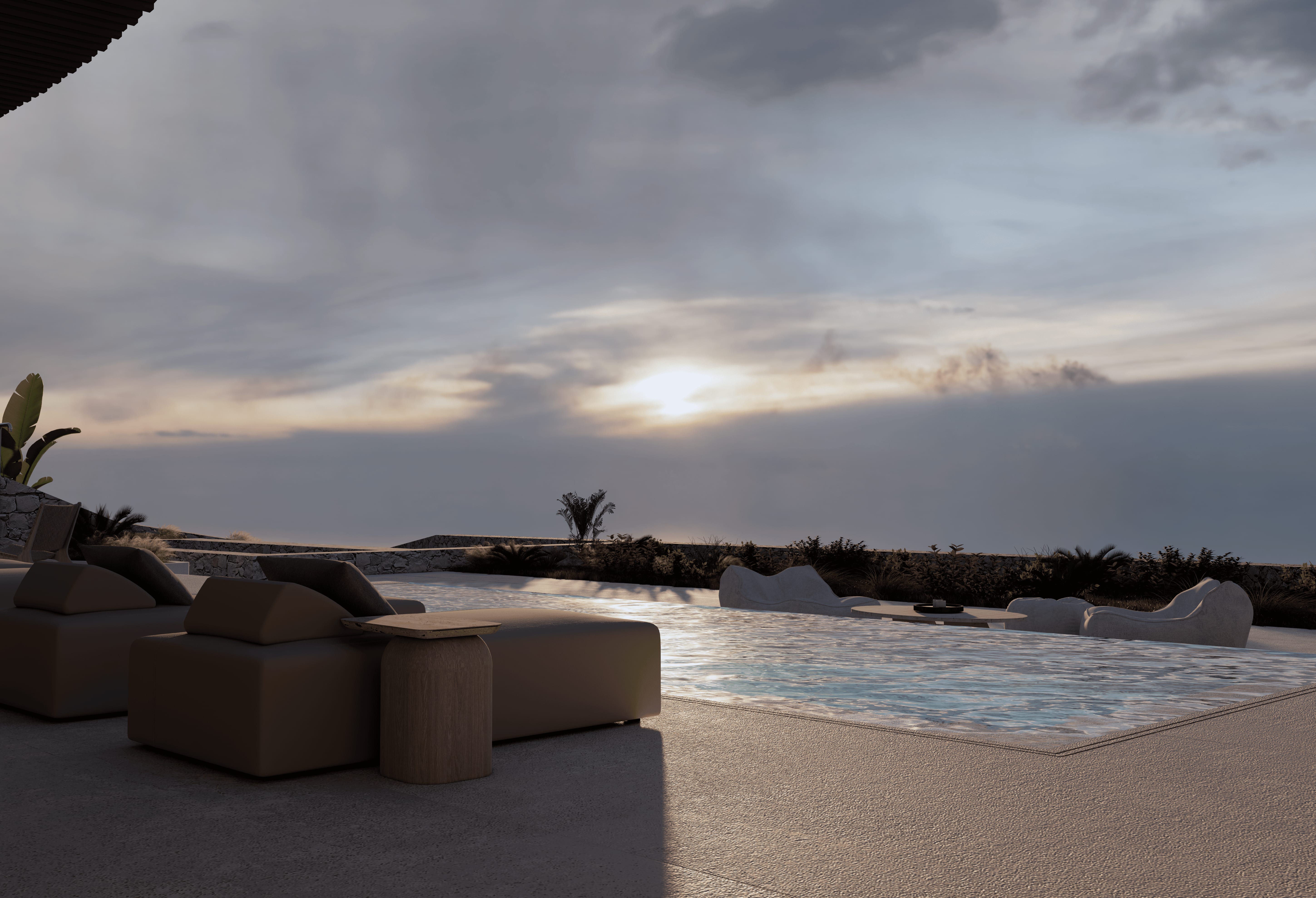 a beach with a pool and rocks