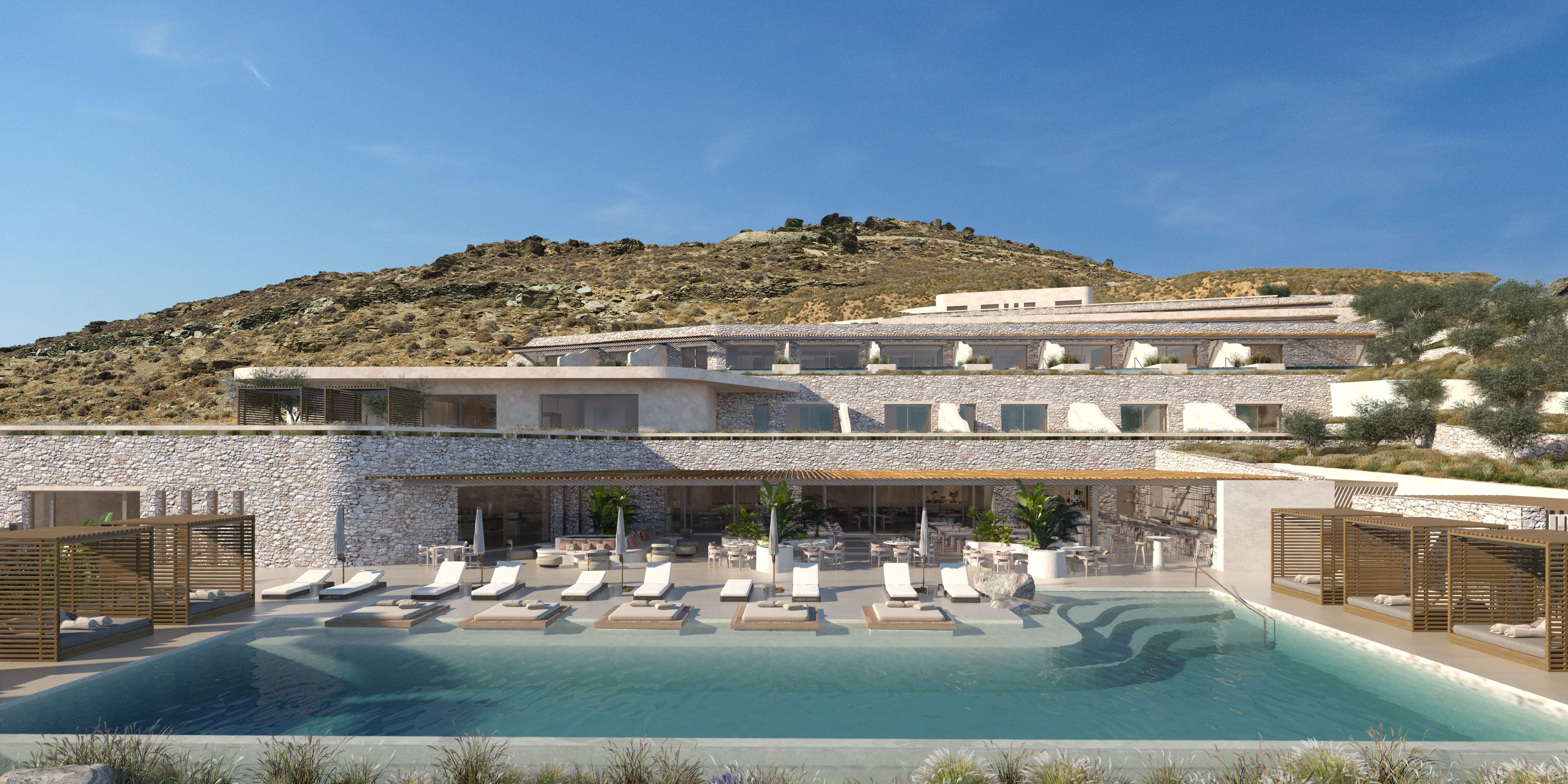 a building with a pool and a hill in the background