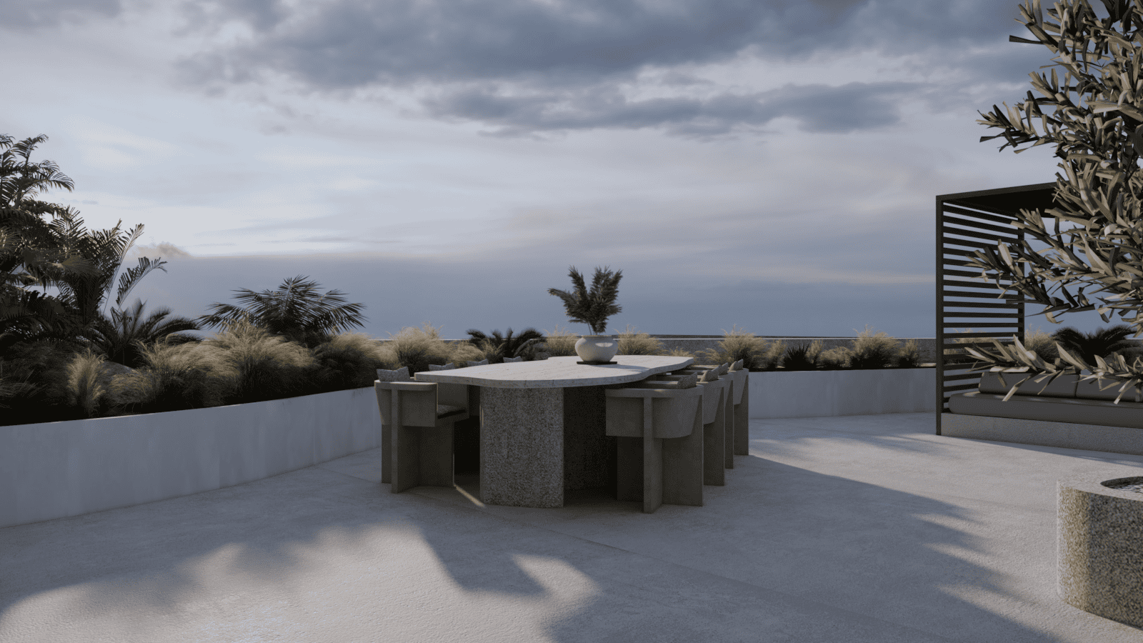 a patio with a table and chairs and a body of water in the background