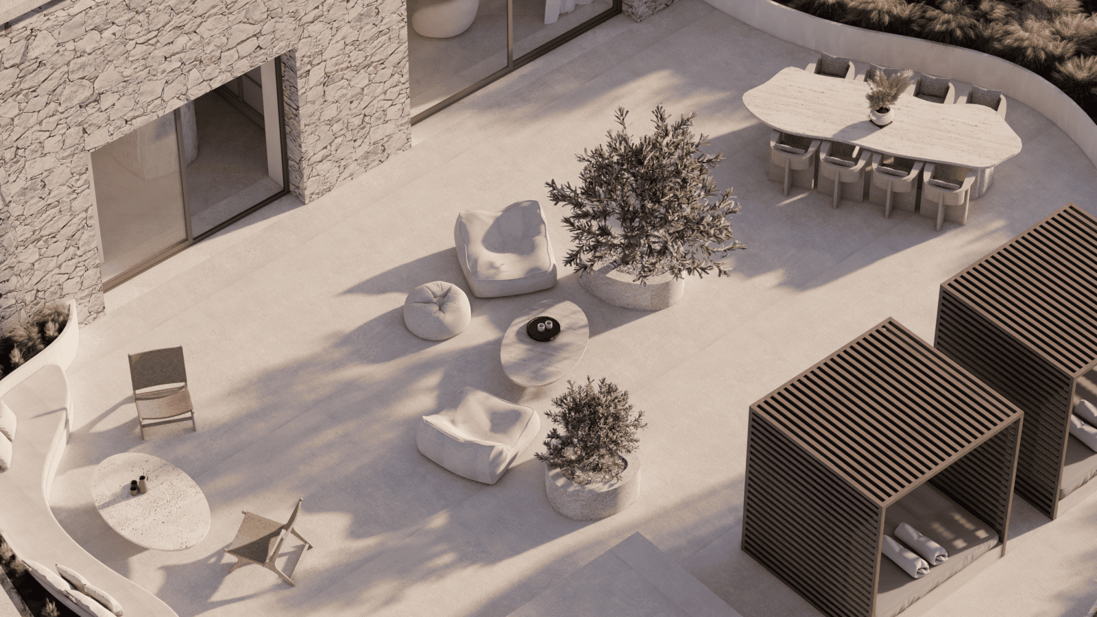 a snow covered patio with a tree and chairs