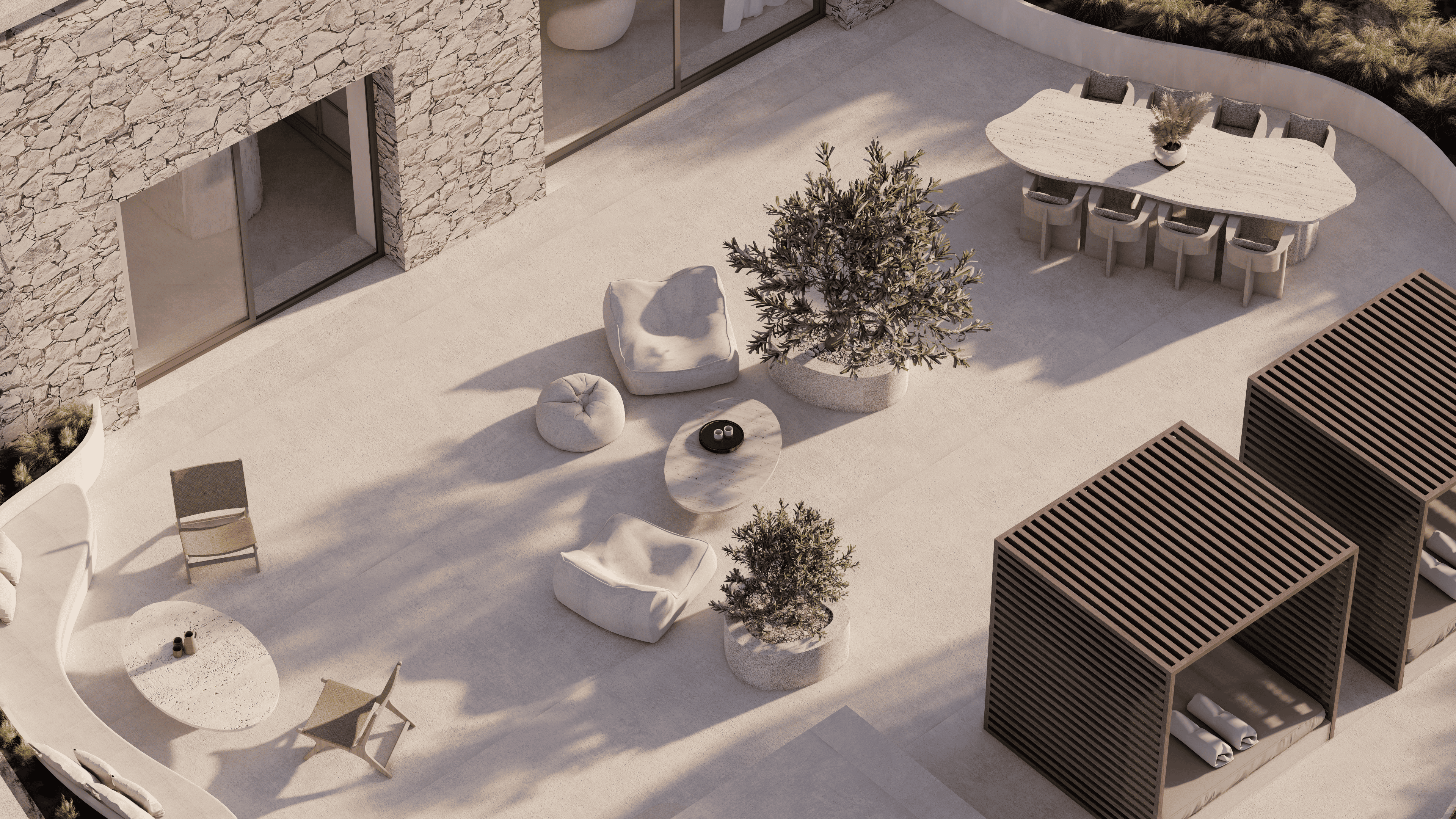 a snow covered patio with a tree and chairs