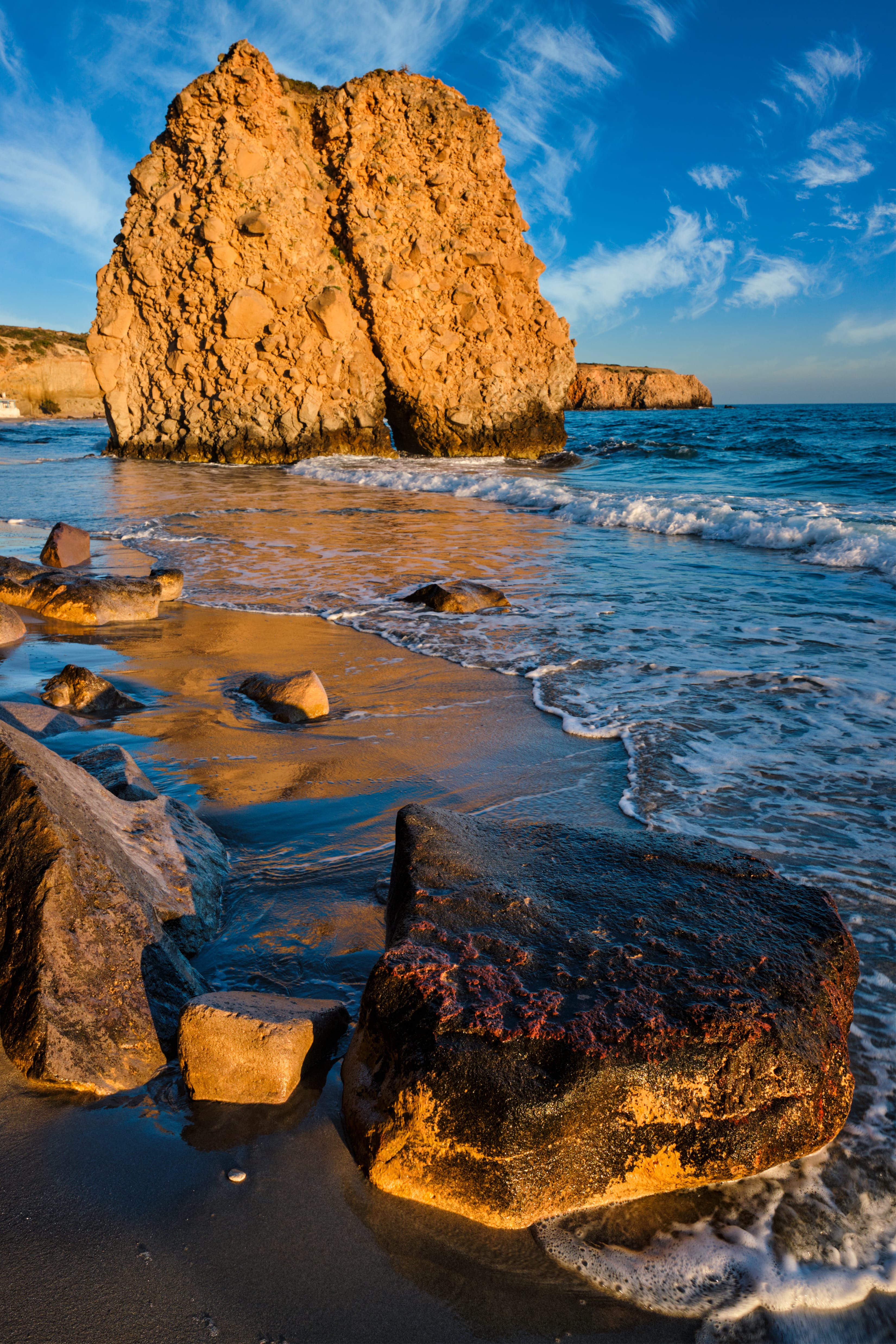 a group of rocks in the water