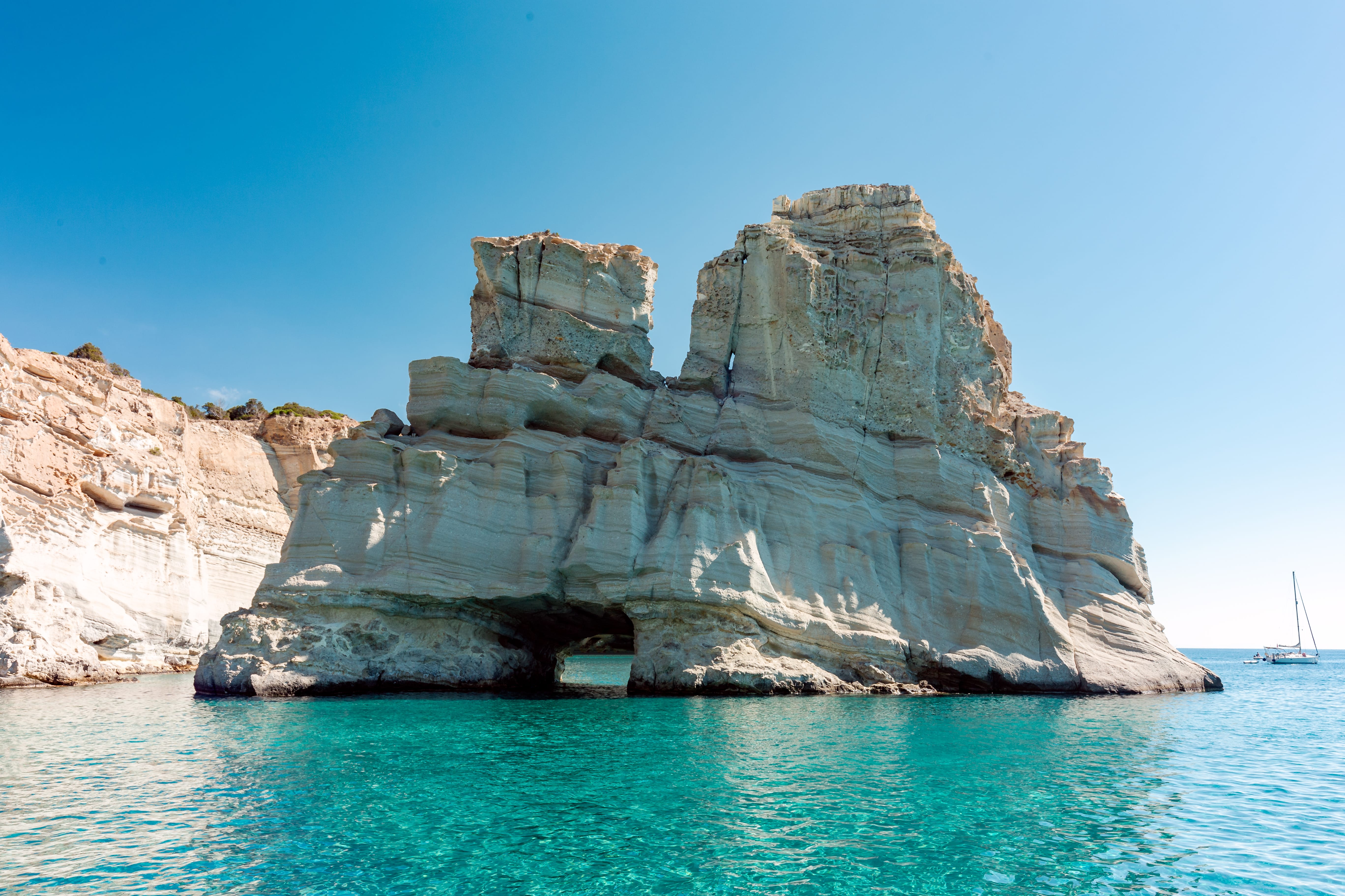 a large rock formation in the water