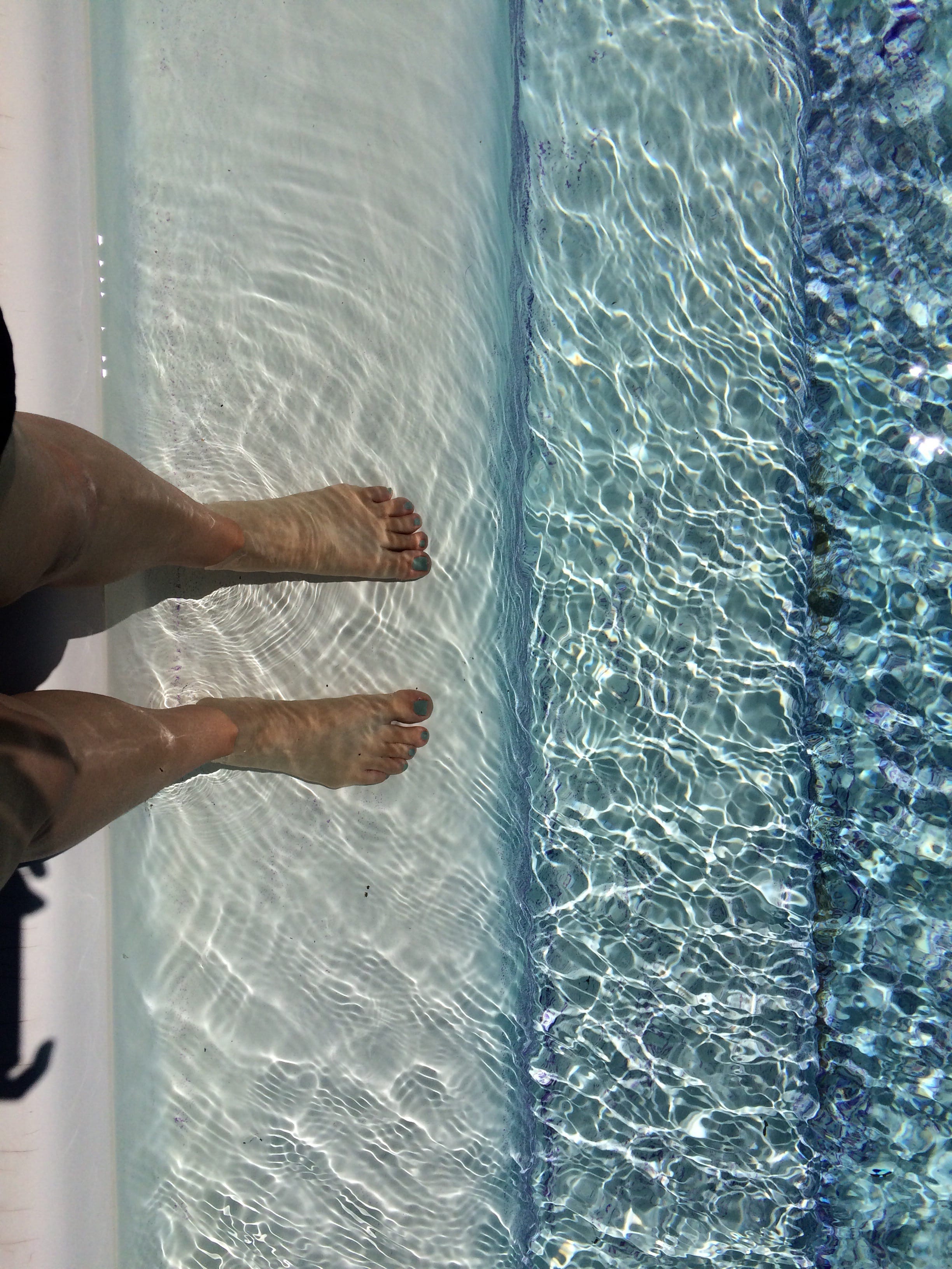 a person's legs on a rug