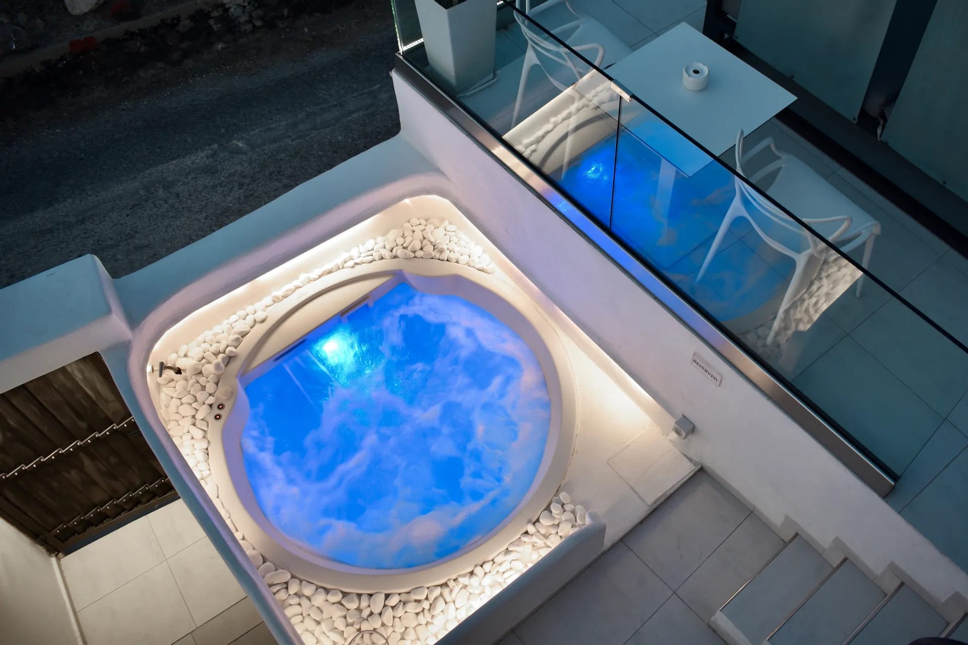 a round blue object with a clear top in a glass case