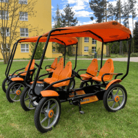 a yellow and black bike with a canopy