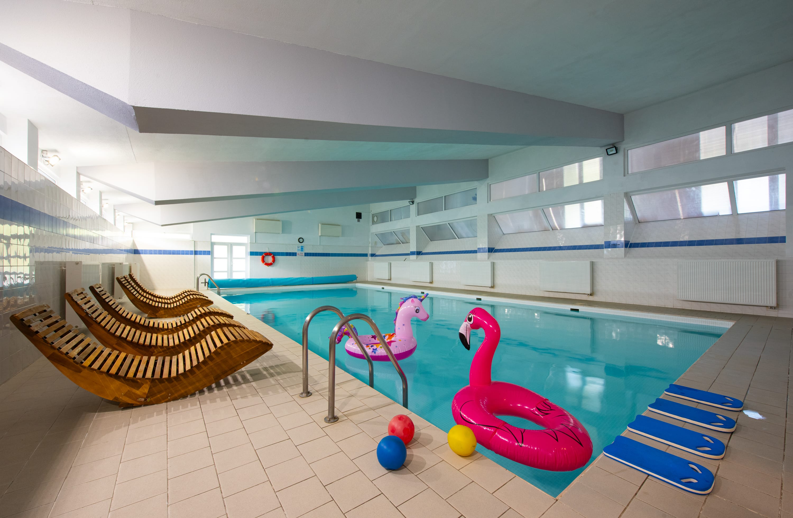 a swimming pool with a hammock and hammock