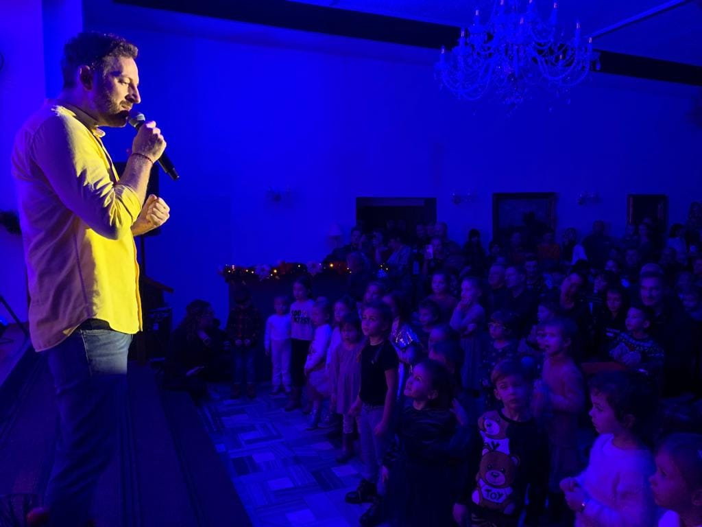 a man singing into a microphone