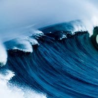 a wave crashing on a beach