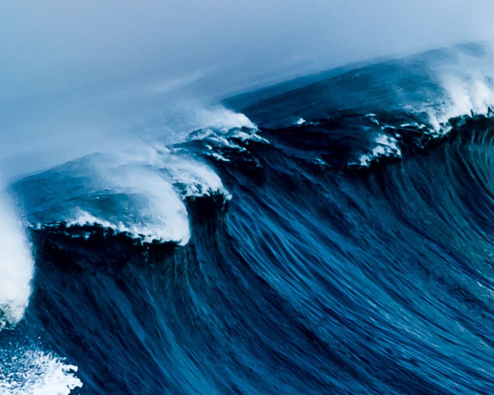 a wave crashing on a beach