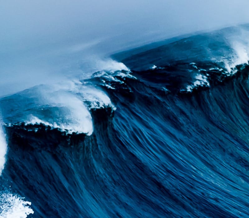 a wave crashing on a beach