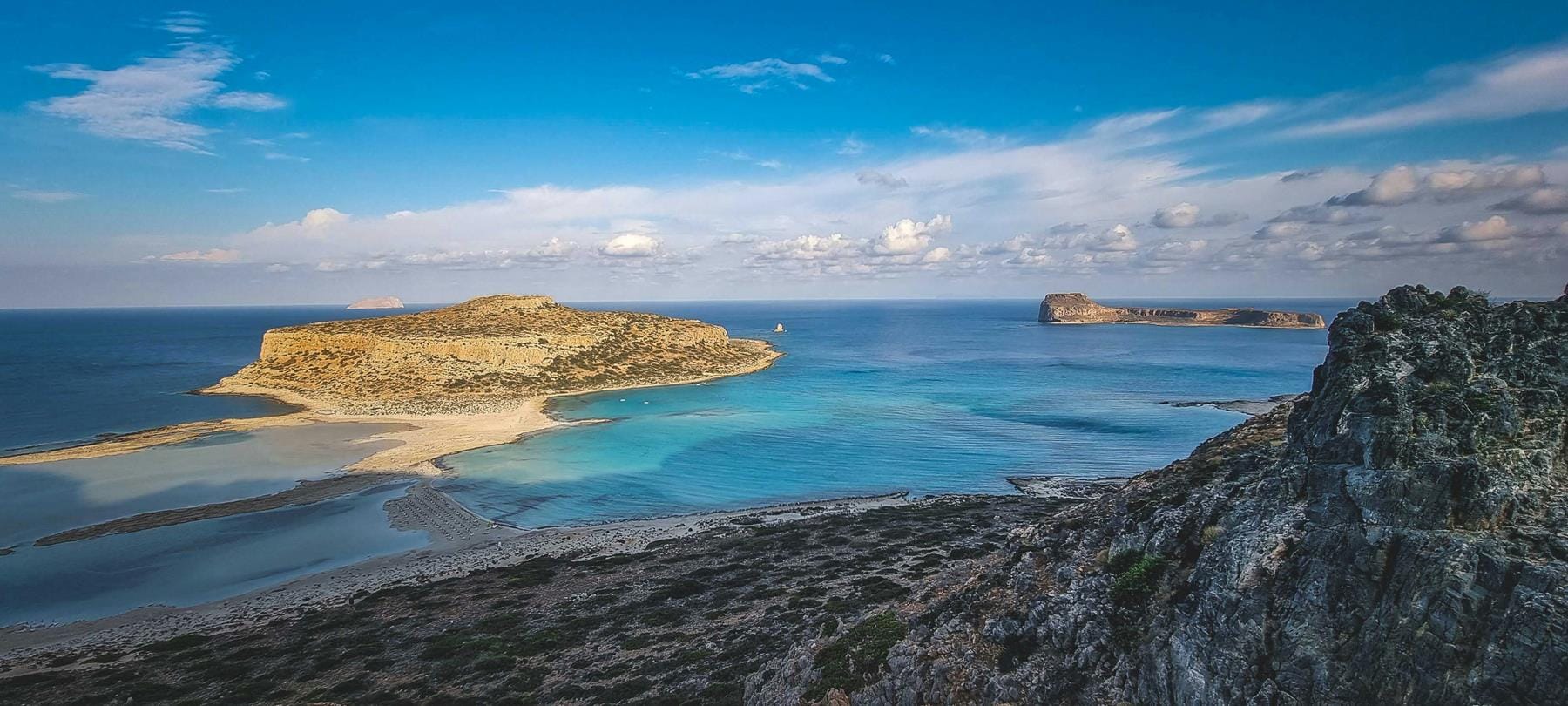 a beach with blue water