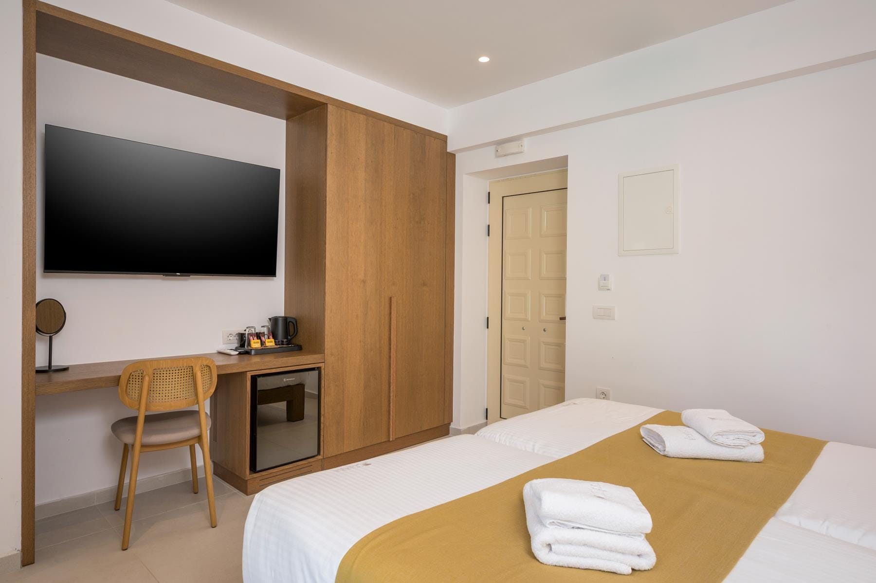 a room with a bed and a tv