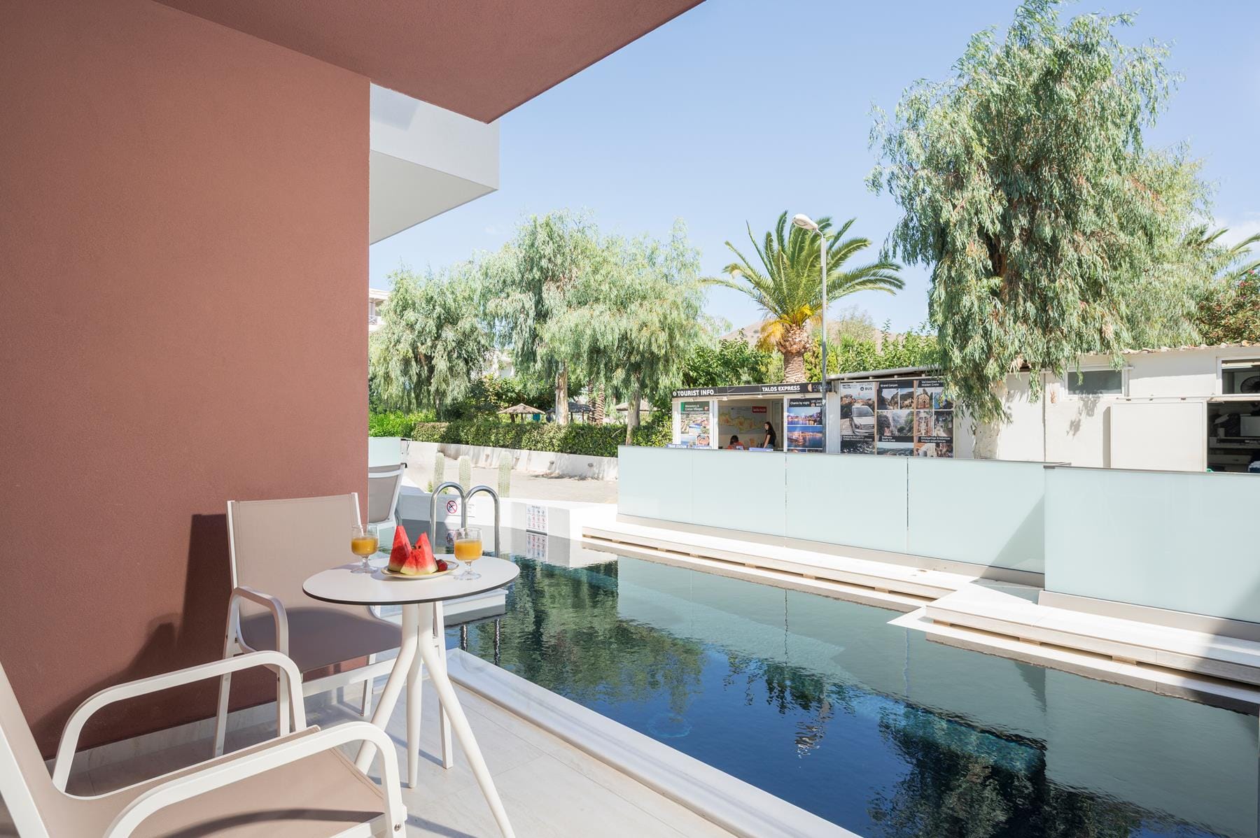 a pool with a table and chairs