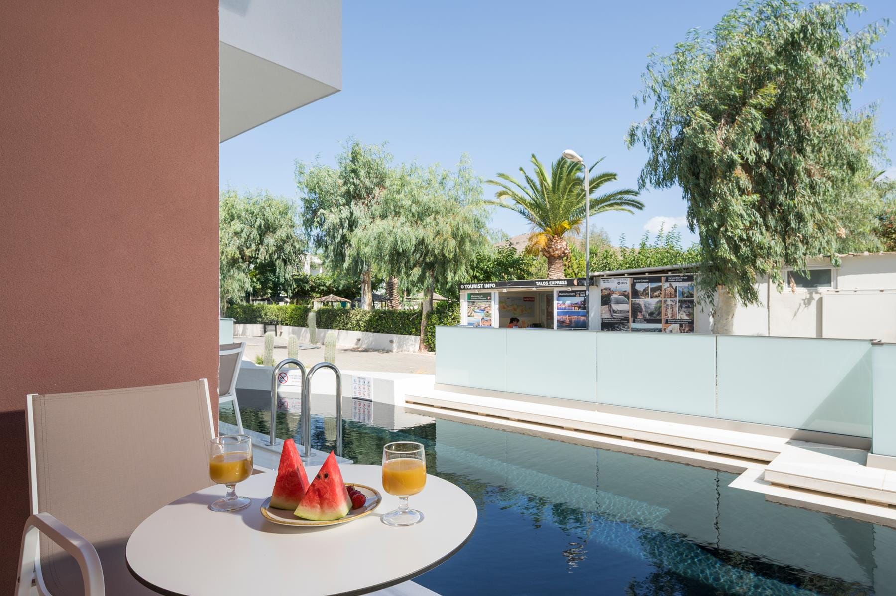 a table and chairs by a pool