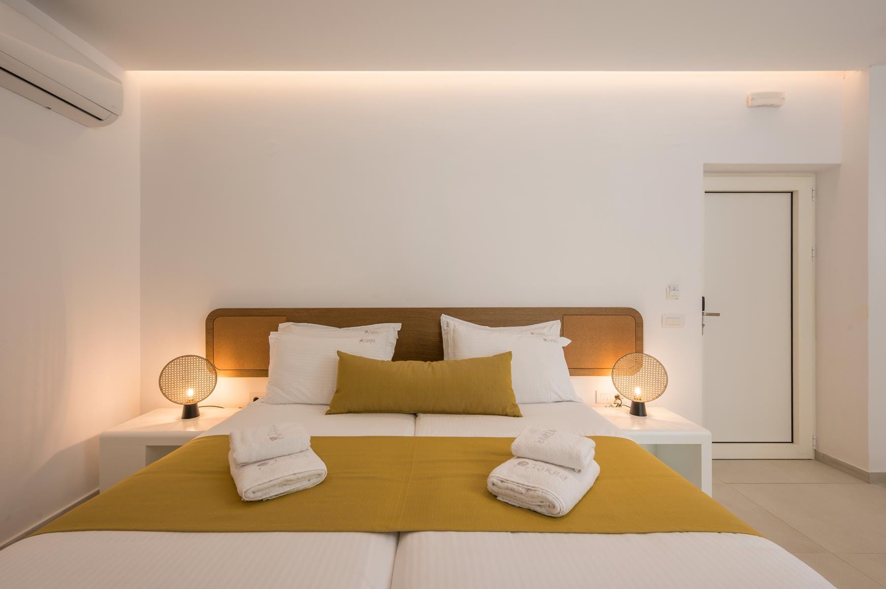 a bed with a lamp on it