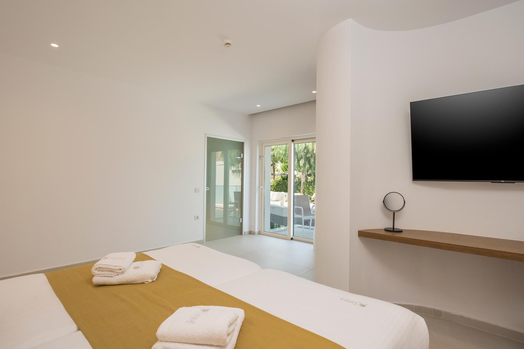 a room with a bed and a tv