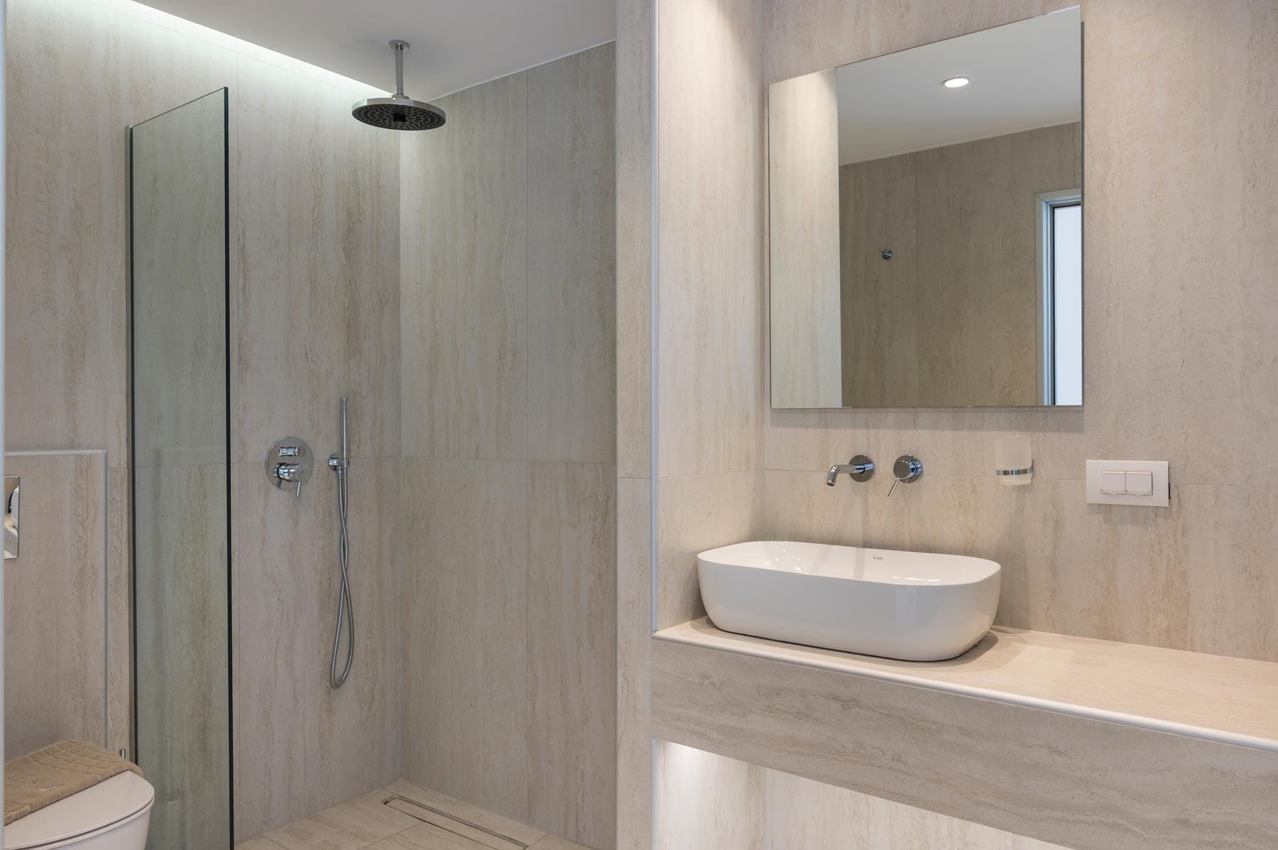 a bathroom with a sink and shower