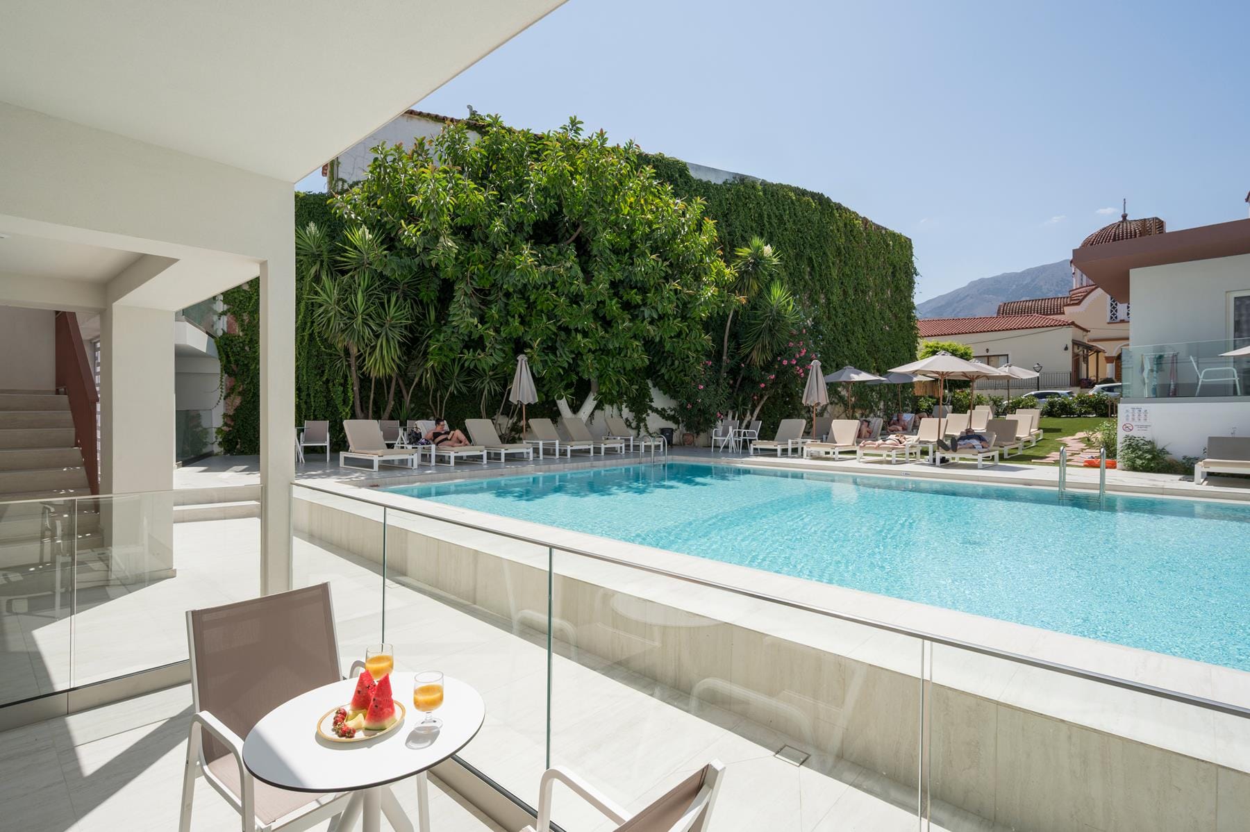 a pool with a table and chairs