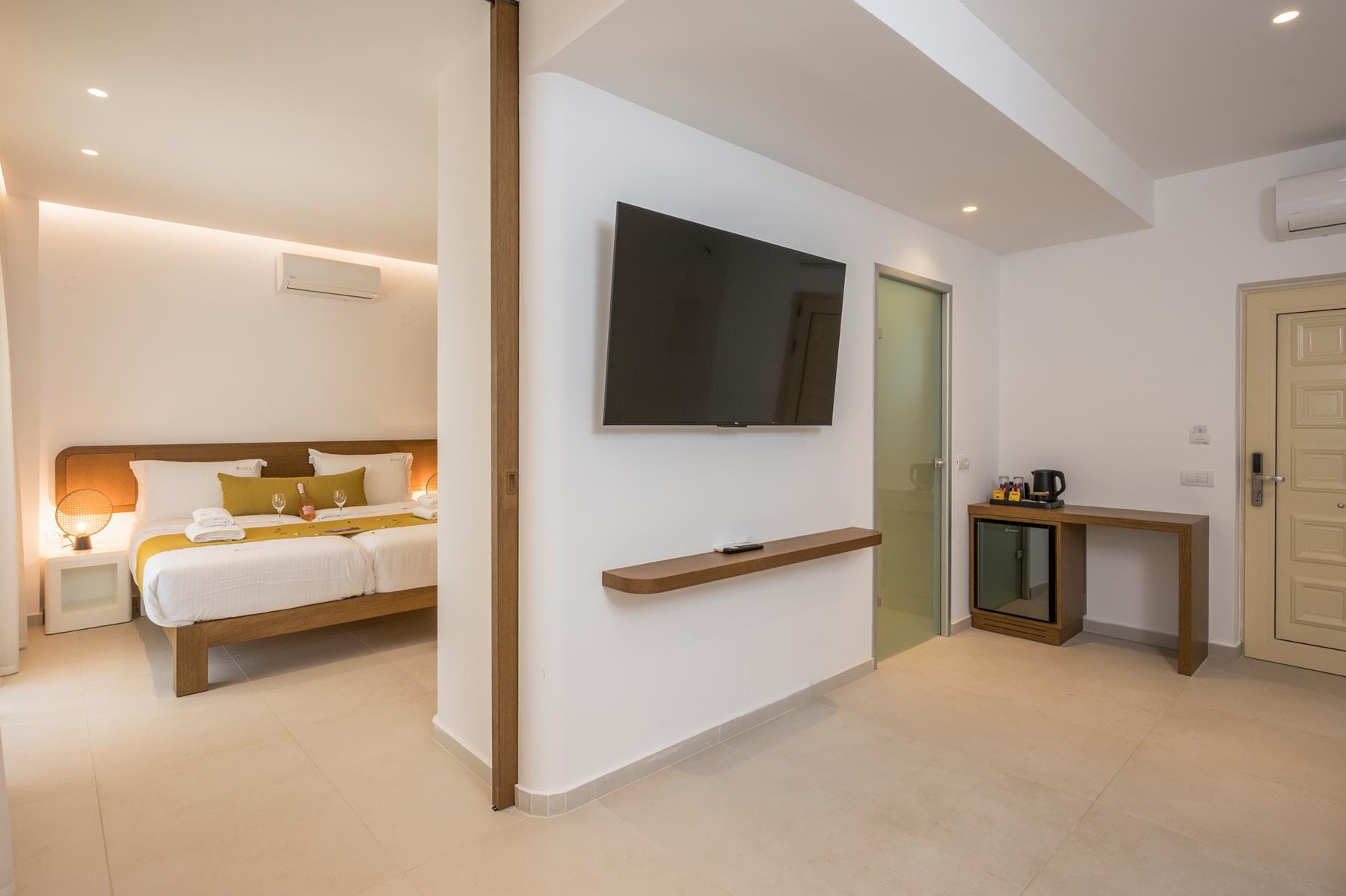 a room with a tv and a bed