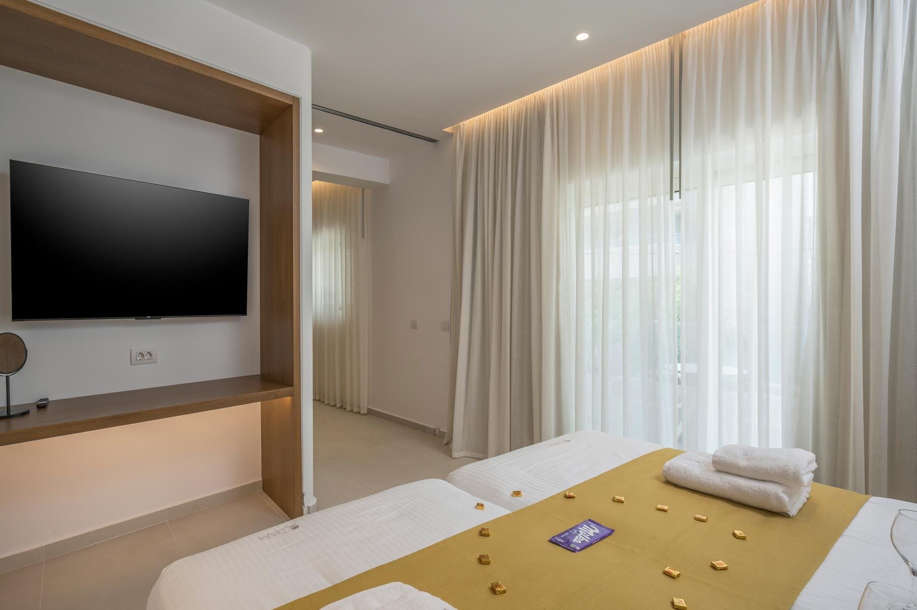 a room with a bed and a tv