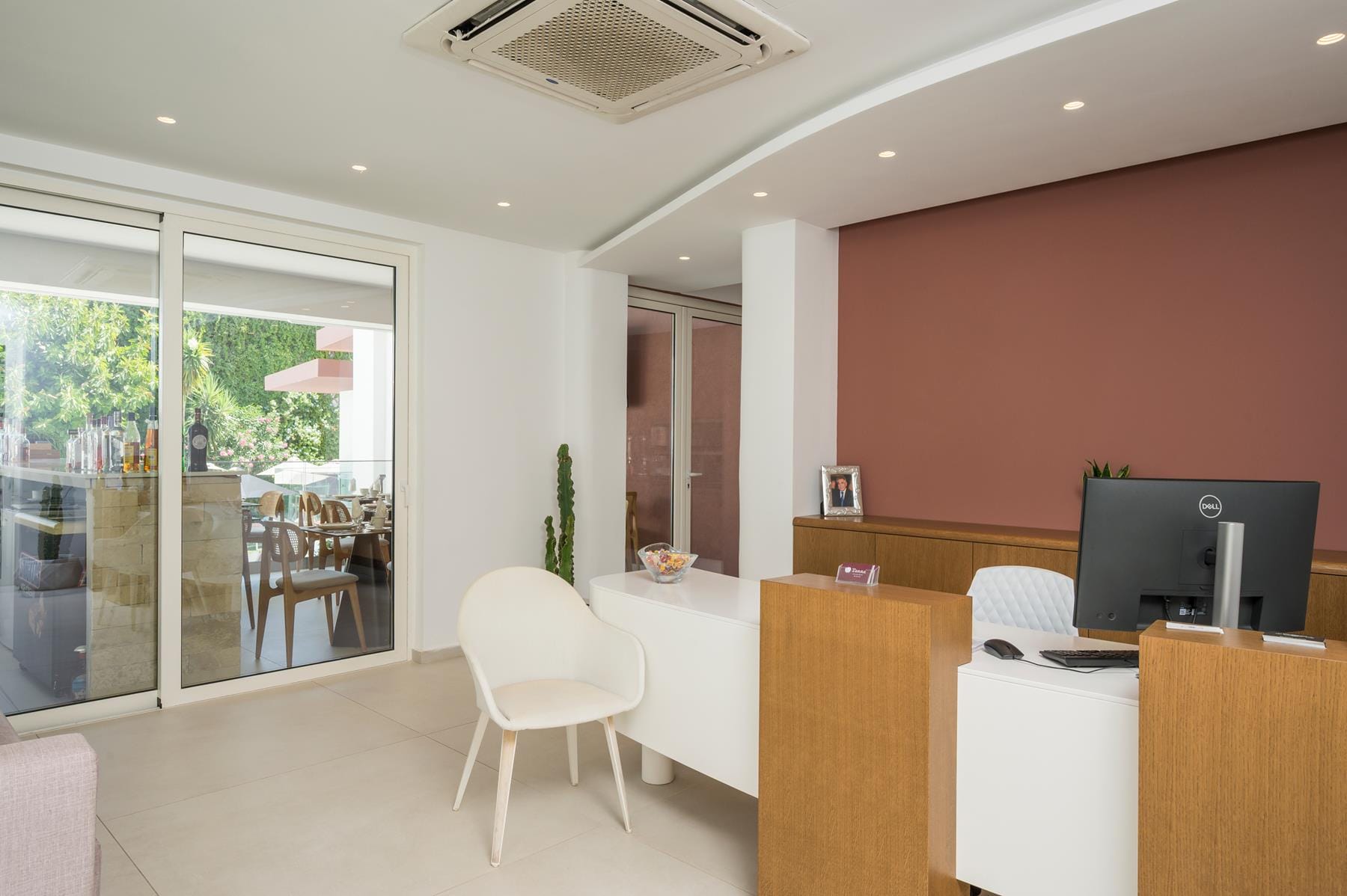 a room with a tv and chairs