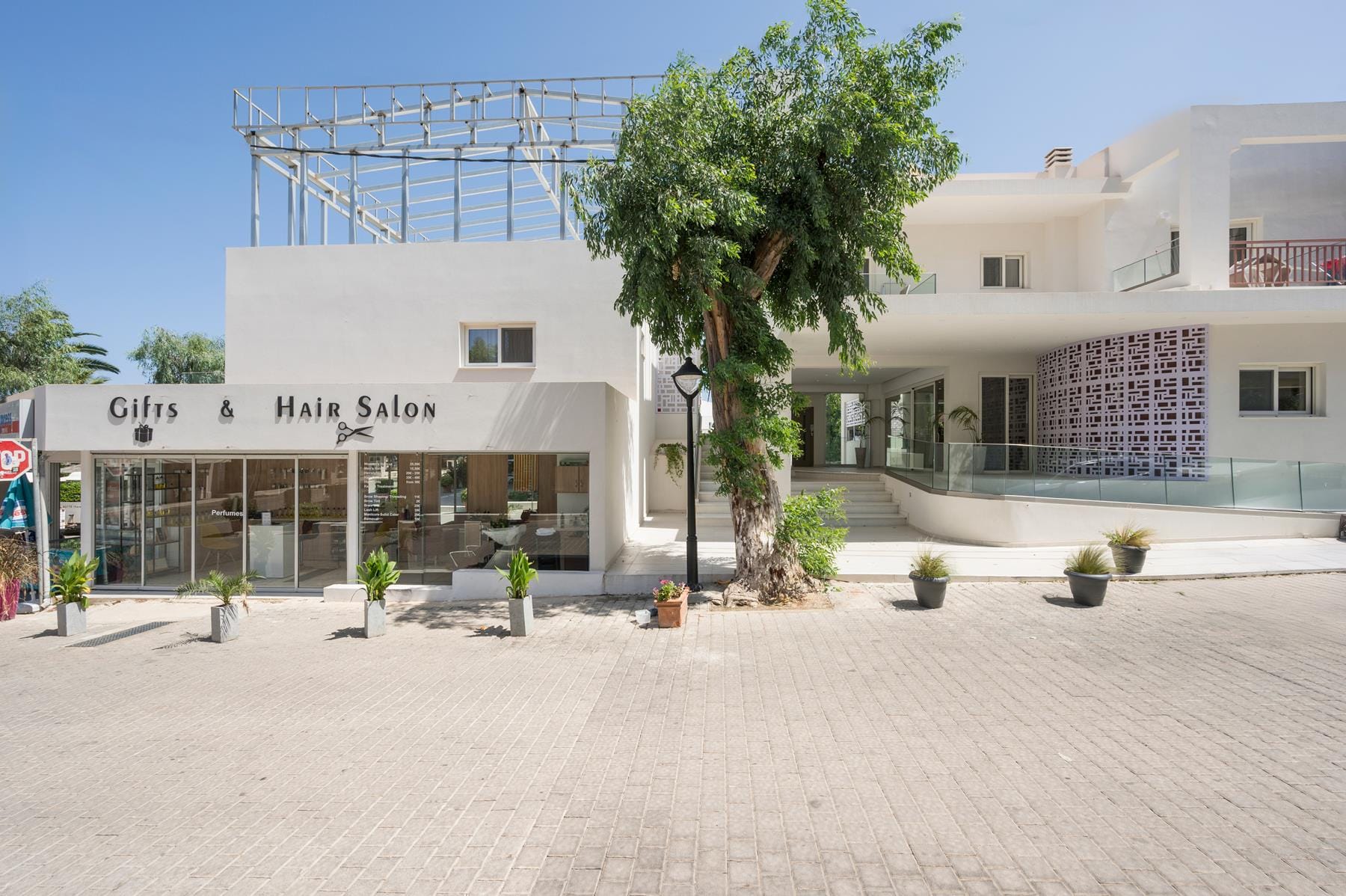 a building with a tree in front