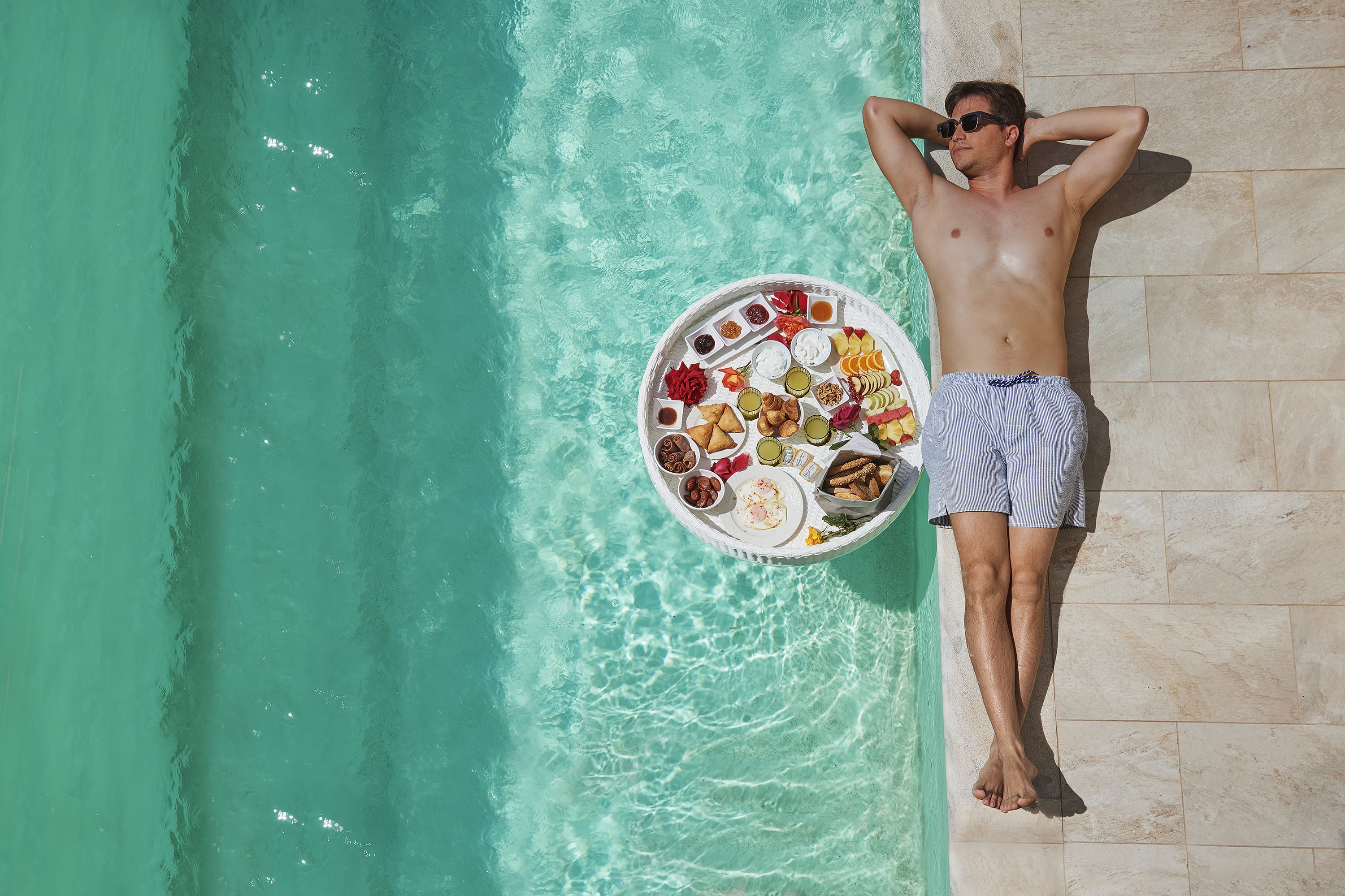 a man standing in a pool