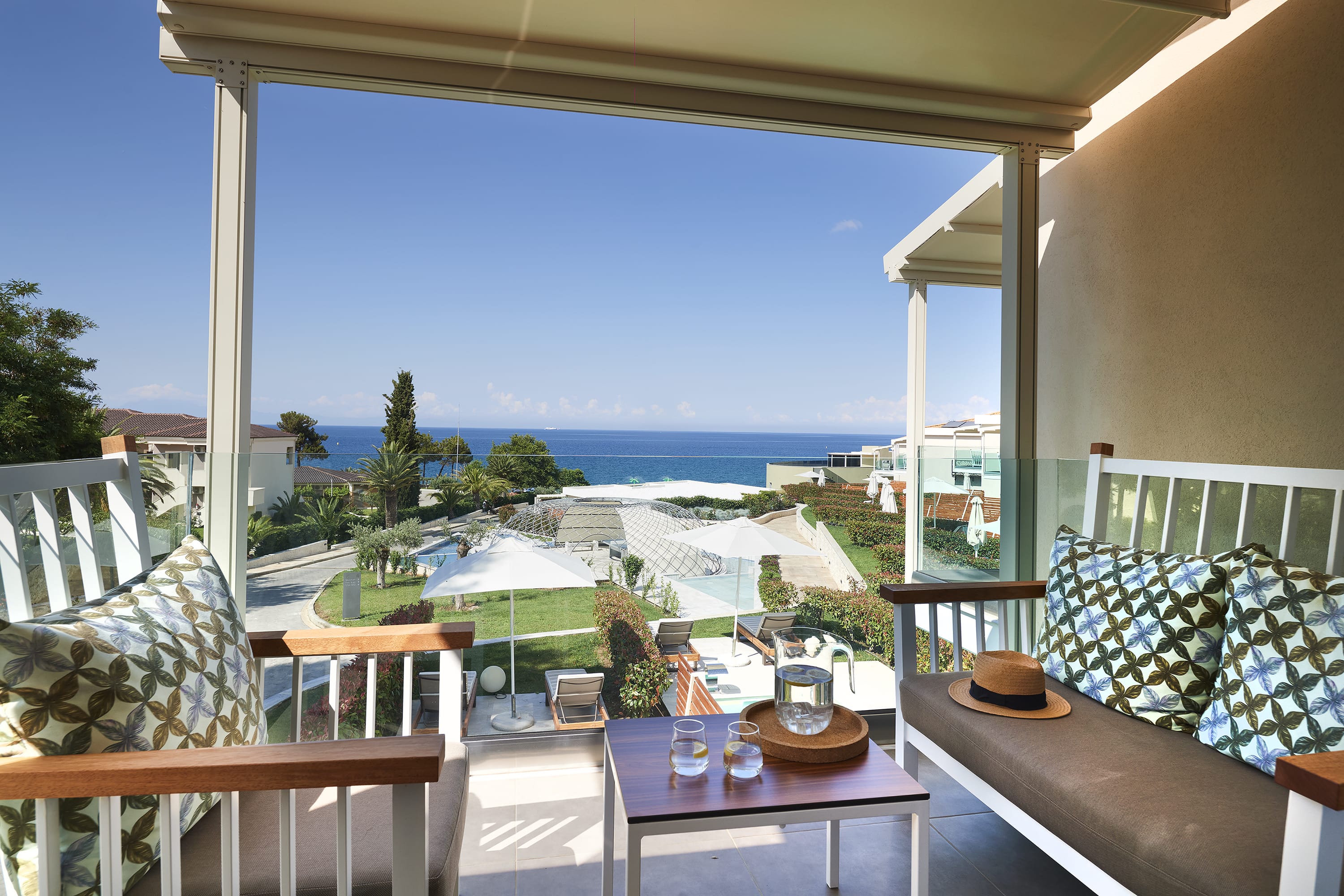 a patio with chairs and a table