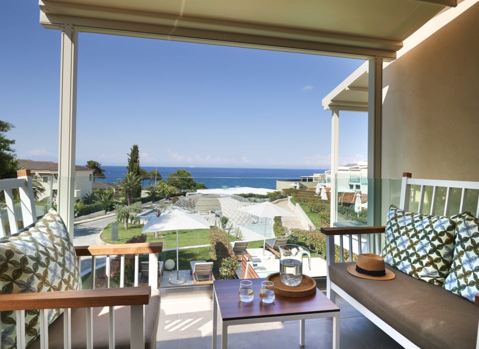 a patio with chairs and a table
