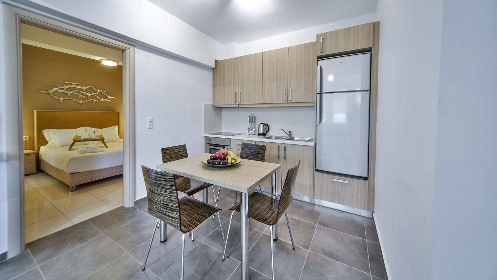a kitchen with a table and chairs