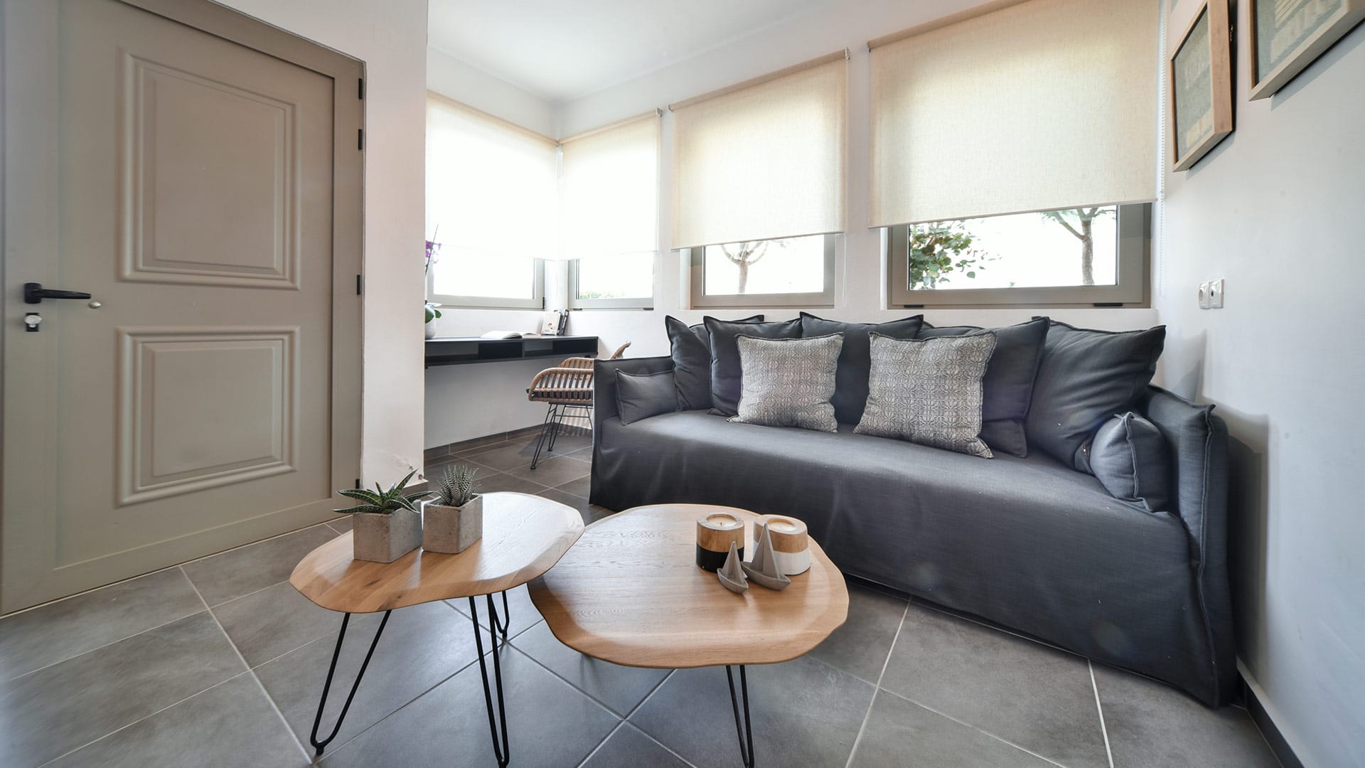 a couch and coffee table in a room with a window