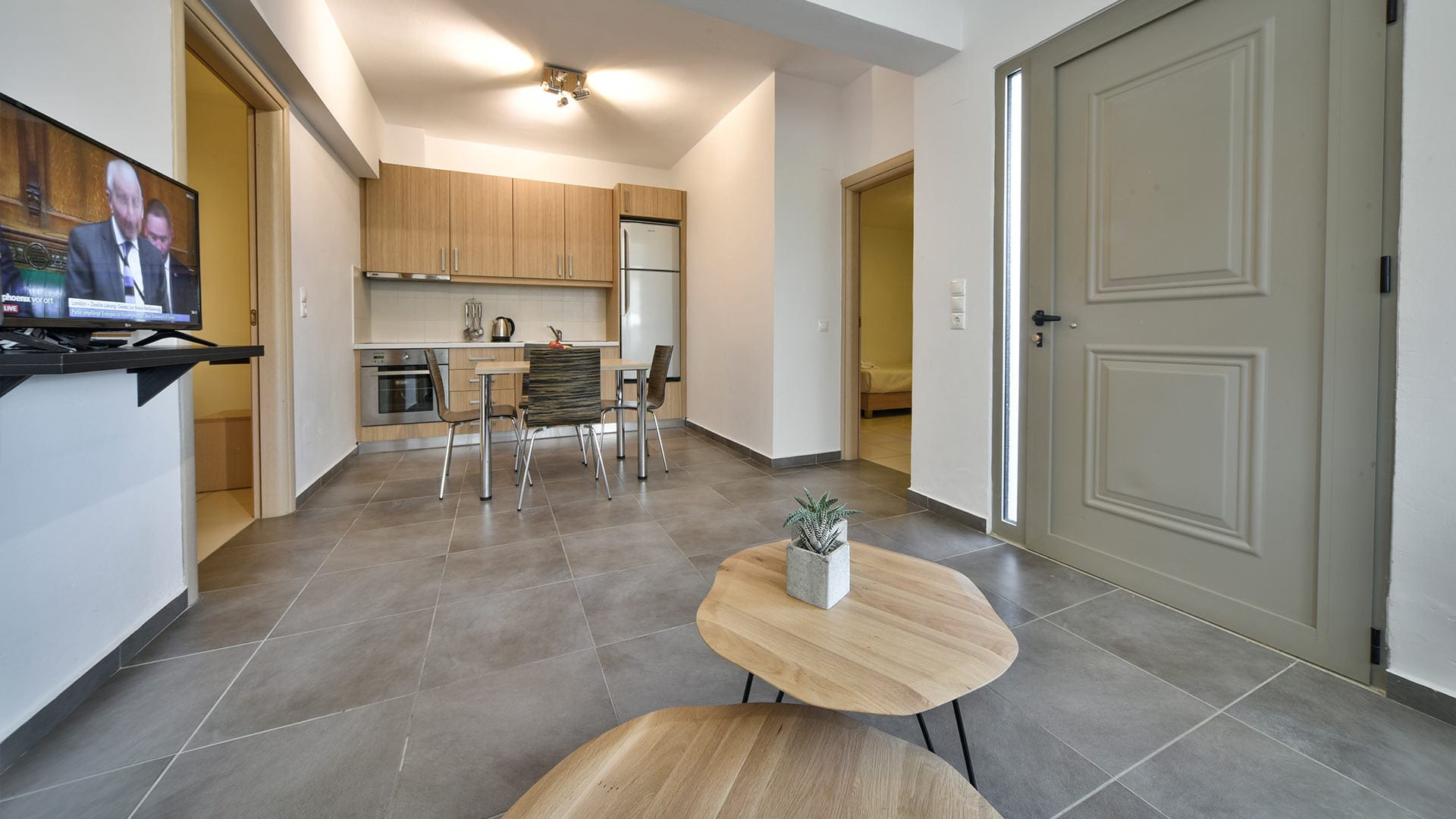 a kitchen with a table and chairs