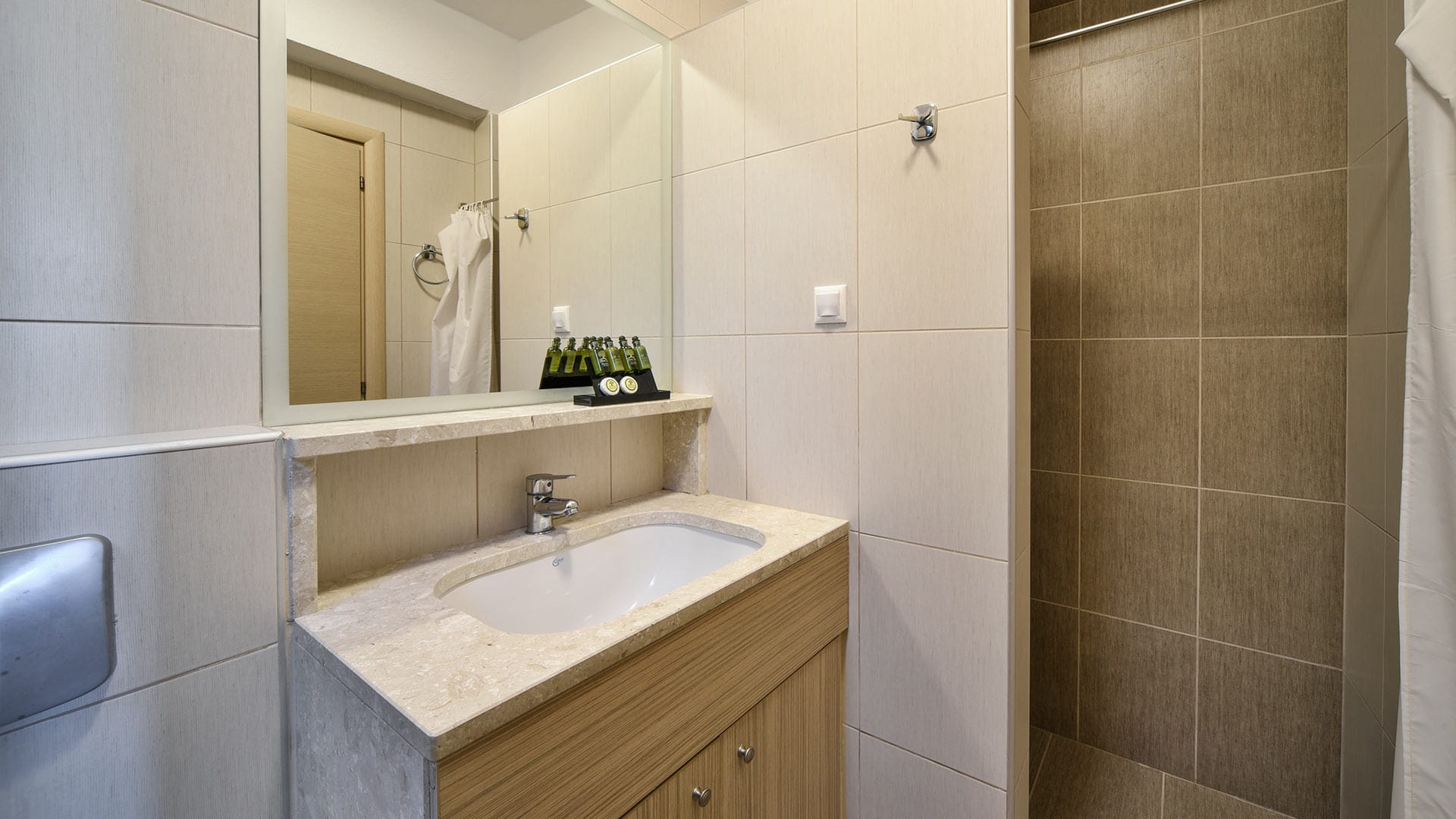 a bathroom with a sink and mirror