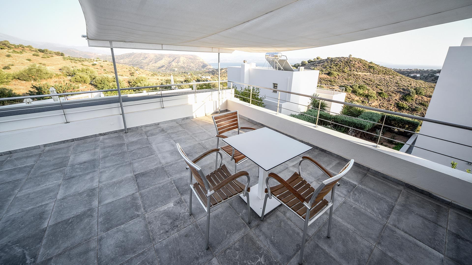 a table and chairs on a deck