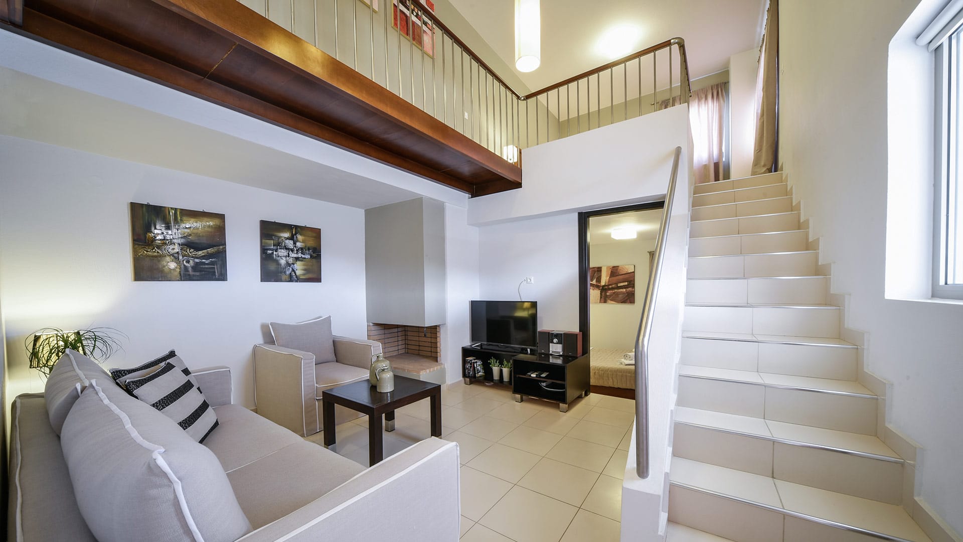 a living room with a staircase